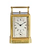 France or Switzerland, a rare, early, petit sonnerie striking carriage clock with alarm and travel case, signed Breguet, gilt, glazed, one piece case with molded base, Roman numeral silvered dial with blued steel Breguet style hands, subsidiary alarm chapter, and engraved "Breguet, a Paris", 8 day, time and strike movement with both trains driven by a single barrel, striking the last quarter in passing, and with grand sonnerie repeating on blued, wire gongs, the polished steel strikework mounted to the back plate, and also bearing a silvered plate engraved "Breguet", duplex platform escapement, with two piece steel escape wheel and brass balance, and with alarm striking on a bell in the base, contained in its original wooden, gilt stamped leather covered case with gilt hardware