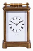 France, for Tiffany & Co., New York, a rare five minute repeating carriage clock, glazed Corniche case, signed Roman numeral white enamel dial, blued steel hands, 8 day, time and strike movement with lever platform and cut bimetallic balance, counting the hours in passing, and repeating the last hour and five minute interval on demand, together with its leather covered wooden travel case