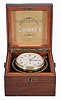 Zenith, Switzerland, a two day, boxed, rim wind and set lever chronometer, the gilt, 19 jewel, 3/4 plate movement with large, monometallic balance, Breguet overcoil balance spring and micrometric adjustment for regulator pin spacing, Arabic numeral silvered dial marked "Chronometre Zenith", with constant seconds and wind indicator, blued steel hands, contained in a brass bowl with gimbals, the whole mounted in a locking mahogany box, the inside of the lid with brass Chronometre Zenith plaque, serial #32655