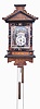 Black Forest, wall clock, 30 hour, time and strike, weight driven wood plate movement in a wood case with ebonized trim, polychrome back painted glass dial featuring two men in 18th century minersi uniforms, a foundry scene, and the words "Gl,ck auf!" ("good luck") -- a greeting German miners used when wishing one another luck. The transferred design on the crest has related imagery including the crossed hammer and pick, a pan, shovel, and lantern. Below the dial on the case are the words "Gott mit uns" ("God with us") which was often used on Prussian heraldry as an expression of unity. On the bracket at the base of the clock is an eagle typical of the Prussian coat of arms.