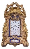 Attributed to Drocourt, Paris, a rare and extremely decorative giant carriage clock in the rococo style, the gilt case replete with scrolls, foliate ornament, and putti, and set with eight gilt and polychrome enamel porcelain plaques featuring garden scenes and frolicking amorini, each on a deep blue field with gilt, foliate border, the Roman numeral dial with blued steel hands, case back with sliding glass panel to allow access for winding and setting, 8 day time, strike, and alarm movement with lever platform, repeating the last hour on demand, gong base marked "A.D." within an oval, serial #29268