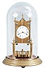 Gerson Wintermantel and Cie., Triberg, Germany, 400 day anniversary clock, spring driven, torsion pendulum movement with disc pendulum in a polished brass case with white enamel dial under dome.