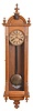 Ansonia Clock Co., New York, "Capitol" model wall timepiece, 8- day double spring movement with seconds bit below 12, in an oak case.