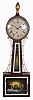 Willard School Patent Timepiece or "Banjo" Clock, Boston, Massachusetts with mahogany case, uniform cut head, painted iron roman numeral dial, half round frames enclosing reverse-paintings on glass, the throat glass with classical urn and leafage flanked by brass sided ornaments, the box glass depicting Zeus on his horse-driven chaise with leafage border and aperture for pendulum viewing, eight day brass time only movement with recoil escapement, lead weight and brass-faced pendulum,