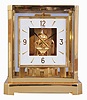 Jaeger- LeCoultre, Switzerland, "Atmos" clock, 15 jewel movement, gilt torsion pendulum, square white painted dial with applied gilt Arabic numerals and arrow markers, gilt hands with black painted tips, all contained in a glazed rectangular case with removable front panel, serial #561214, c1983.
