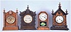 Clocks- 4 (Four): (1) Ansonia TURKEY in golden oak, embossed dial, 8 day; (2) Ansonia TORONTO in oak and with original crazed finish; (3) German copy of octagon top cottage clock, unknown duration, and (4) a German "Alt Deutsch" style shelf clock with a copy of the Ansonia 8 day movement.