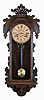 Ansonia Clock Co., New York, "Queen Isabella", 8 day, time and strike in a pressed and carved oak wall case.