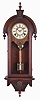 Wm L. Gilbert Clock Co., Winsted, Conn., "Pendant" model wall clock in walnut, 8 day time and bell strike.
