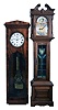 2 (Two) Modern: (1) Colonial Clock Co., Zeeland, MI, reproduction pinwheel jeweler's regulator in a mahogany veneer case with beveled glass door. Colonial copied the French regulator hanging in Sir John Bennett's Clock Shop at Greenfield Village, MI. (2) Emperor tall clock time, strike and chime, weight driven movement in a walnut case with purpose made leaded stained glass panel on door built by Gus Chinery, 1975