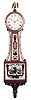 E. Howard & Co. Boston, Mass., "No. 95 Banjo Clock", the special order mahogany case surmounted by a cast brass eagle finial, roman numeral dial signed "E. Howard & Co./ Boston", slightly convex frames with two lines of segmented dark and light inlays frame the superb reverse-paintings on glass, the lower depicting the patriotic scene of American and British war ships (presumably the Constitution and the Guerriere) both flying their national colors set within Patriotic iconography including a draped American flag, canons, an anchor and a central eagle perched on a Federal shield for pendulum viewing all framed by gilt flaming columns, the waist glass flanked by brass side ornaments depicts a floral basket, cross-hatched cartouche and finial with draperies and floral spray, below a carved pedestal with balls and acorn drop, eight day brass weight powered movement stamped "E. Howard & Co./Boston" with maintaining power, Geneva stop and recoil escapement with front plate viewing ports, all powered by a lead weight and regulated by a brass faced pendulum bob and flat wooden rod.