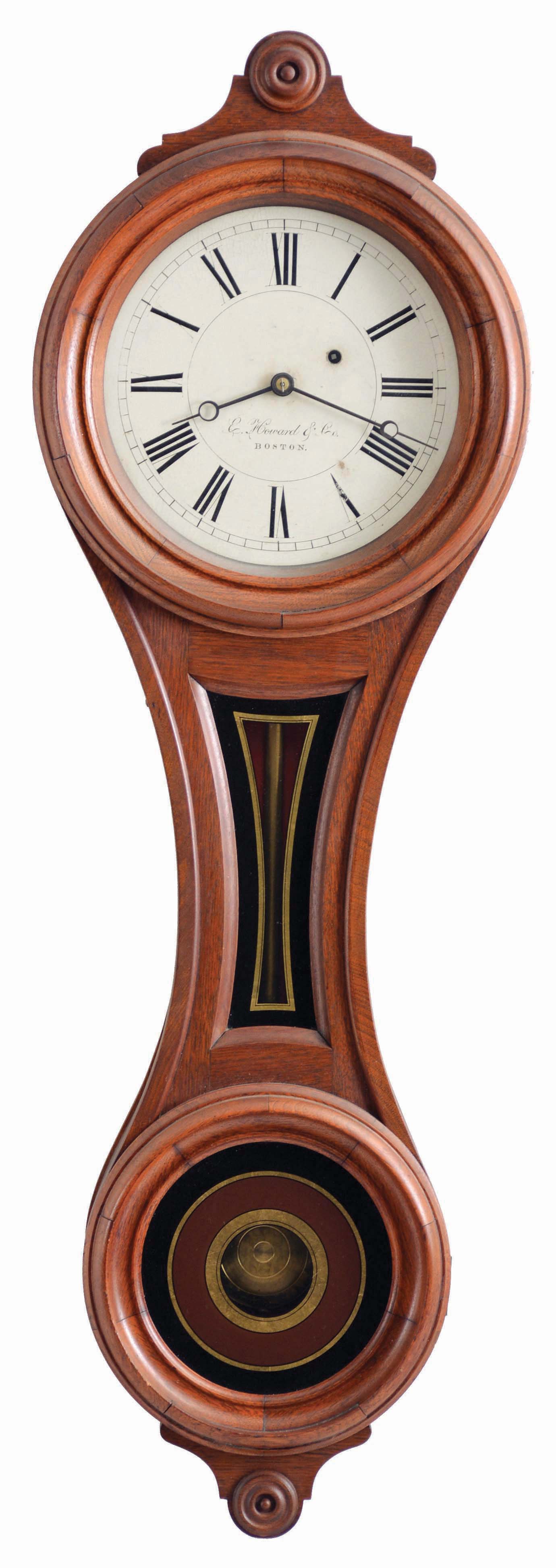 E. Howard &amp; Co., Boston, Mass., "No. 9 Regulator", walnut "figure eight" style case with turned wooden bezel and lower door, reverse painted glasses in black, red, and gold, signed, Roman numeral painted dial with blued steel moon hands, and 8 day, weight driven timepiece movement — Antique Clocks Price Guide