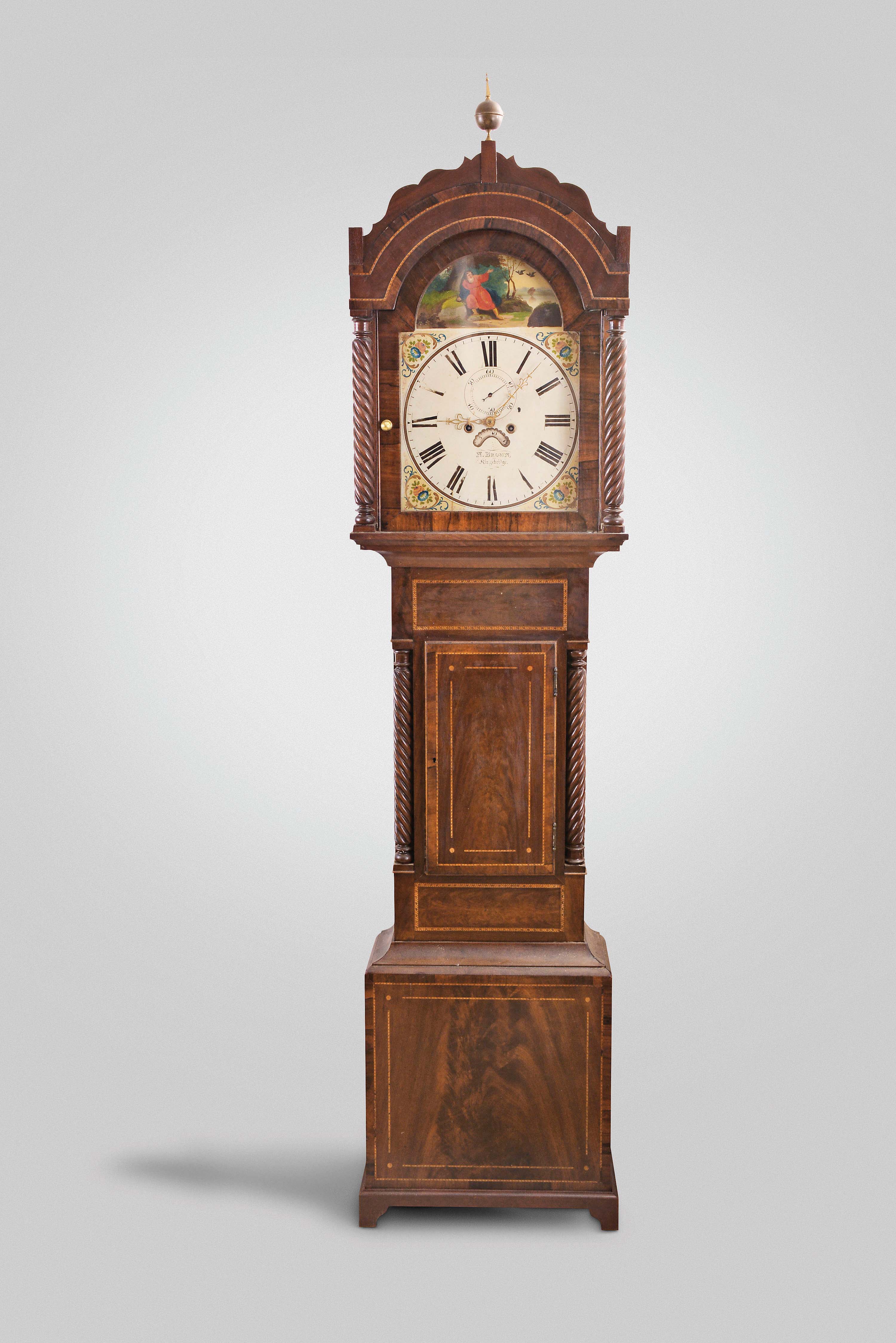 N. Brown, Kingsbridge England, tall case clock, 8 day, time and bell strike, weight driven movement in an inlaid mahogany case with rope turned columns with painted metal dial, signed by the maker — Antique Clocks Price Guide