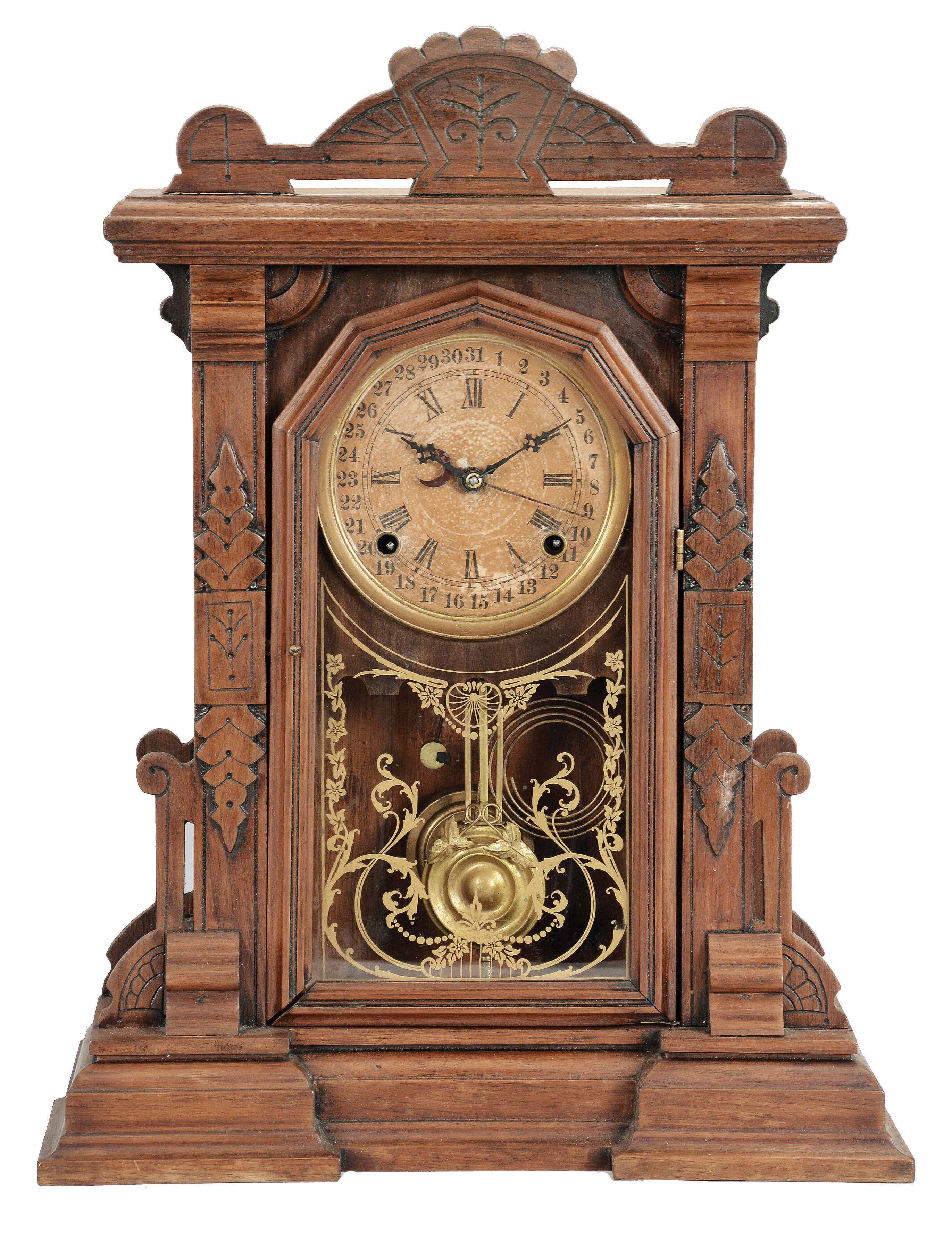 E. Ingraham &amp; Co., Bristol, Conn., premium model made expressly for the Lovell Manufacturing Co., Philadelphia. This is a shelf clock with a spring driven, 8 day, time and strike movement with a simple calendar mechanism in a walnut case. — Antique Clocks Price Guide