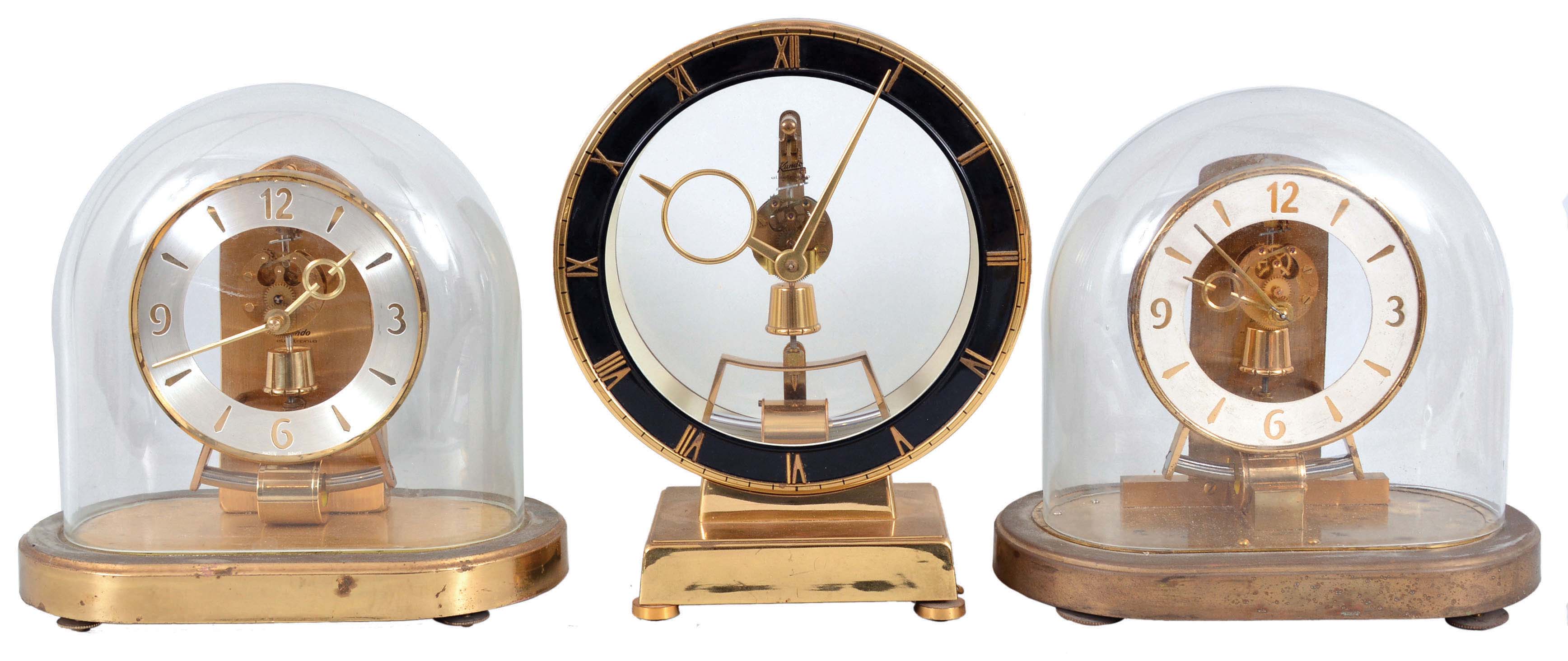 Clocks- 15 (Fifteen) Electro-mechanical and 400-Day: 4 (Four) battery-powered Kundo clocks with magnetically impulsed pendulums and 11 (Eleven) 400 day or anniversary clocks by makers such as Koma, Schatz, Kieninger Obergfell, Kundo and others. — Antique Clocks Price Guide