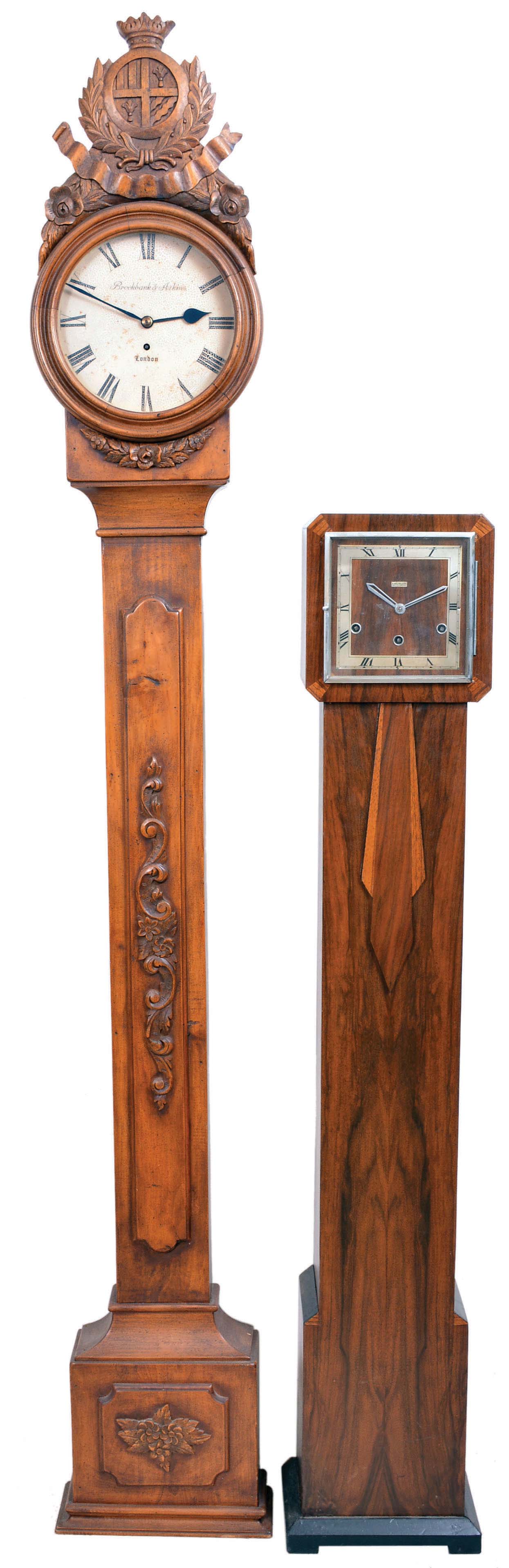 Clocks- 2 (Two) English Floor Standing: (1) Perivale/Anvil, London for B. Walton &amp; Sons, Chester, floor standing clock, 8 day, three train Westminster chime, spring-driven movement in an Art Deco walnut case with square chapter, c. 1930; (2) Brockbank &amp; Atkins, London, floor clock, 8 day, time only, spring-driven fusee movement in a pine case with carved applied ornaments and crest, painted metal dial, c1890. — Antique Clocks Price Guide