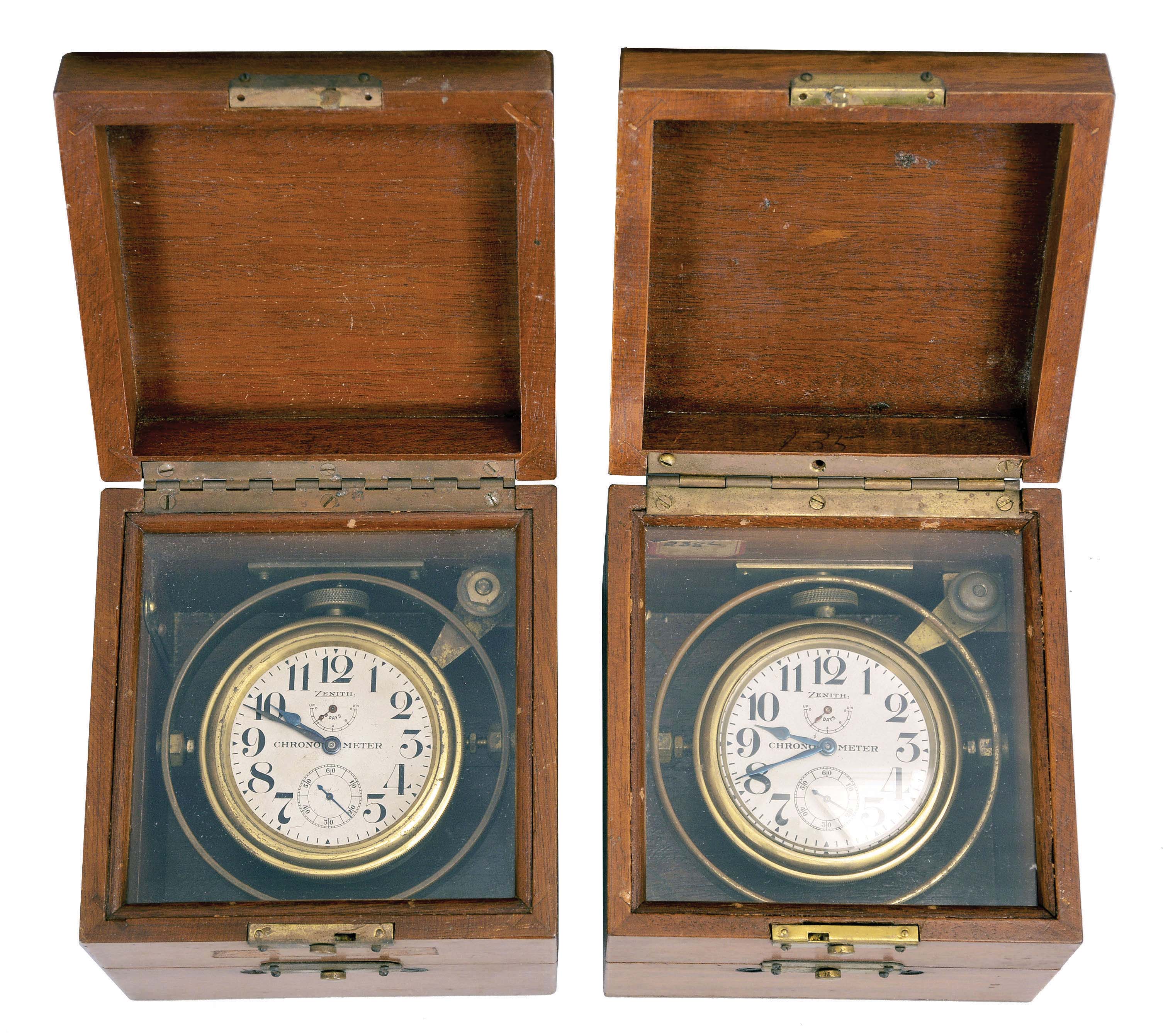Deck watches- 2 (Two), Zenith / Vail Watch Co., 8 day, mounted chronometer watches, 15 jewel stem wind and set nickel movements, silvered dials with wind indicator and blued steel hands, contained in gimballed brass bowls, with 3 tier mahogany boxes — Antique Clocks Price Guide
