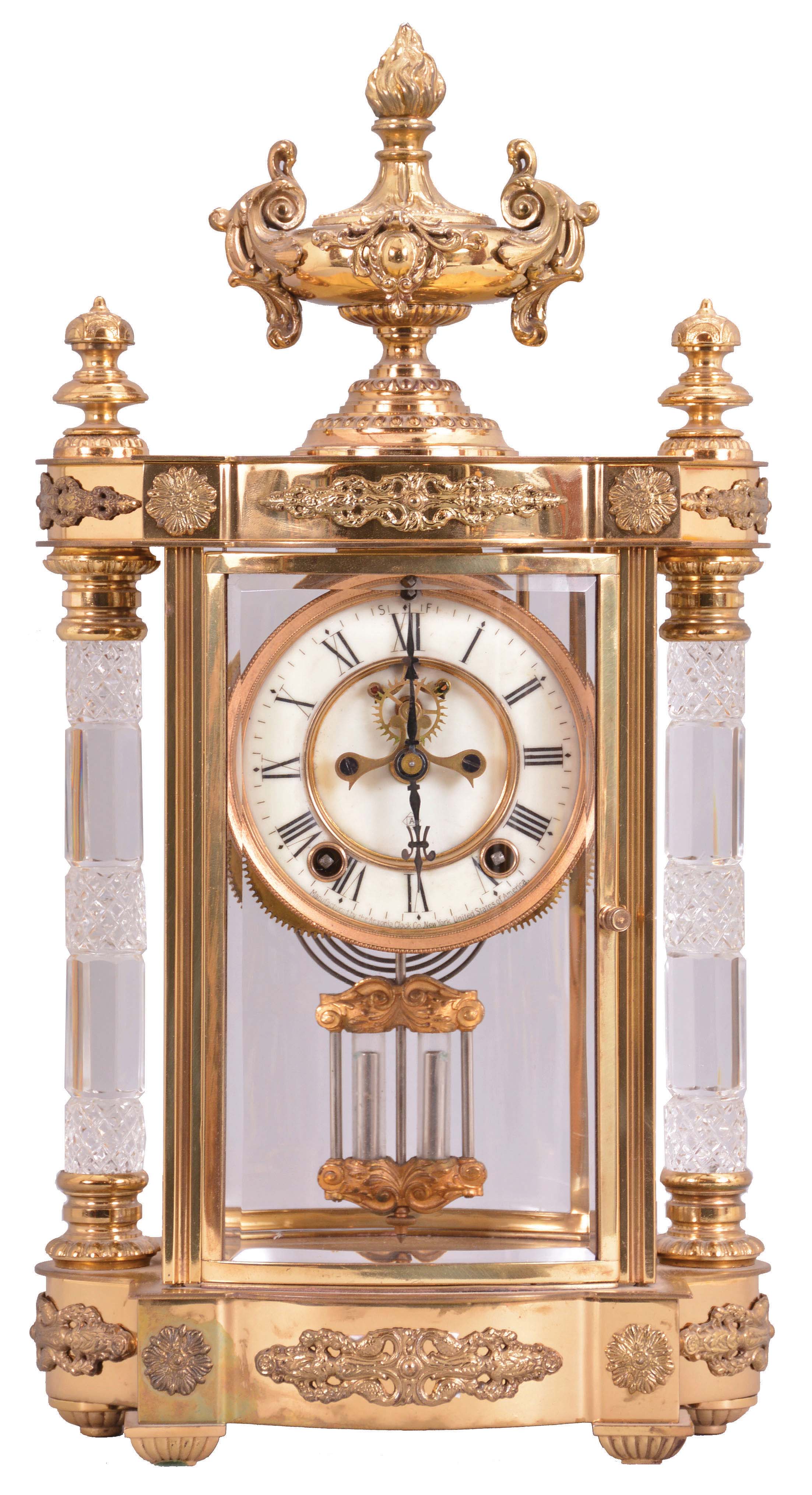 Ansonia Clock Co., New York, "Jupiter", 8 day, time and strike, spring driven brass movement with cut glass columns crystal regulator mantel clock with visible escapement. — Antique Clocks Price Guide