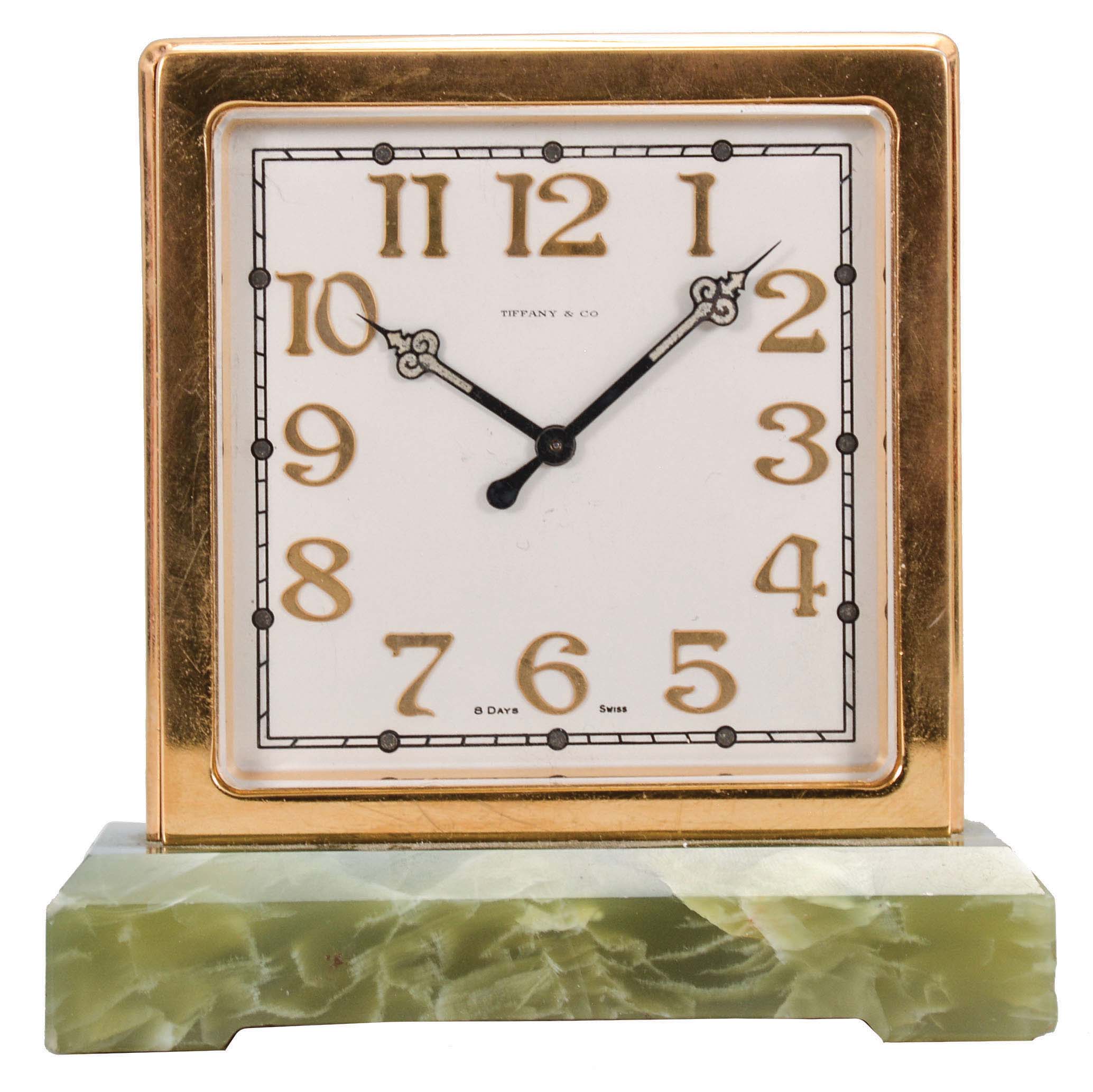 Switzerland, for Tiffany &amp; Co., New York, a two sided desk clock, the rectangular green onyx base supporting the square, gilt case, silvered dials with applied, gilt arabic numerals, luminous black steel hands, 8 day, timepiece movement with lever escapement — Antique Clocks Price Guide