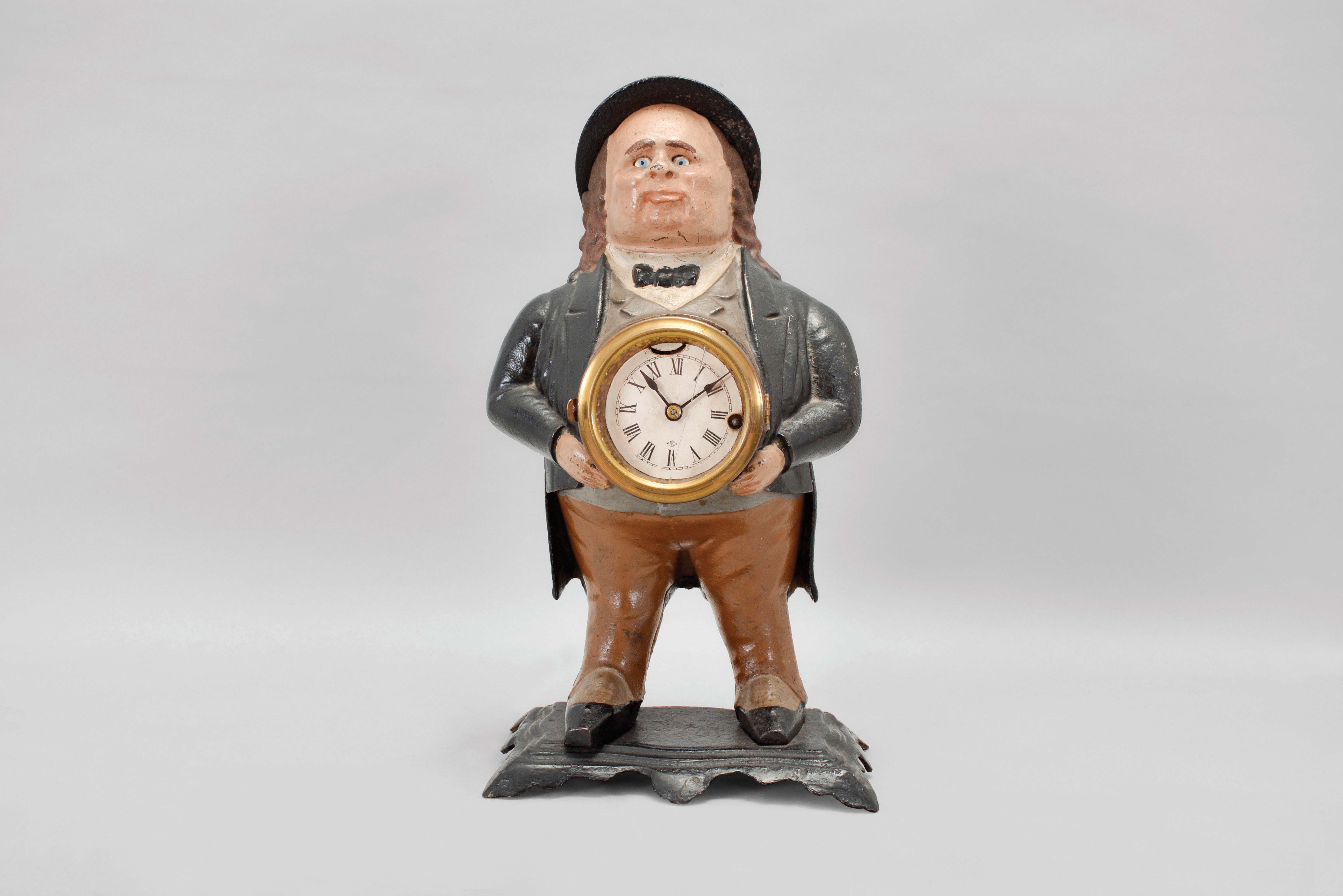 Bradley &amp; Hubbard, Meriden, Conn., "John Bull" blinking eye shelf clock with a spring driven, 30 hour, timepiece with a balance wheel escapement in a painted cast iron case. — Antique Clocks Price Guide