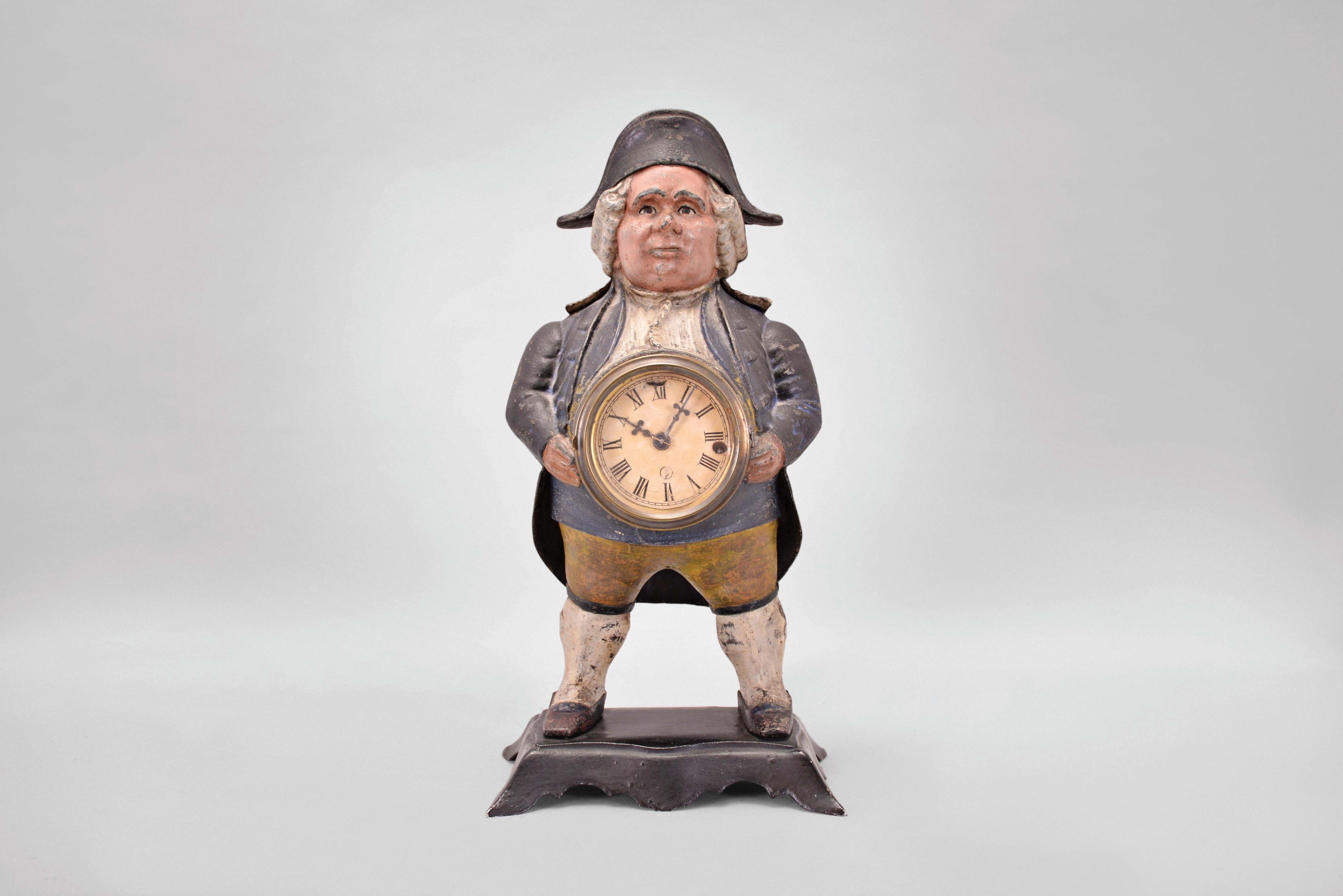 Bradley &amp; Hubbard, Meriden, Conn., "Continental" blinking eye shelf clock with a spring driven, 30 hour, timepiece with a balance wheel escapement in a painted cast iron case. — Antique Clocks Price Guide