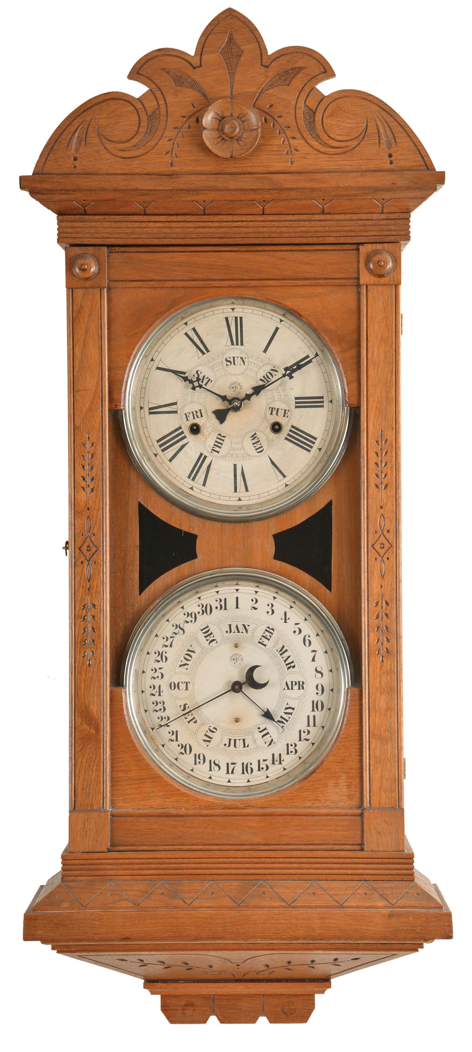 Jerome &amp; Co. (New Haven Clock Co.), New Haven, Conn., "Dneister" wall hanging double dial calendar clock with a spring driven, 8 day, time and strike movement and a B. B. Lewis perpetual calendar mechansim in a walnut case. — Antique Clocks Price Guide