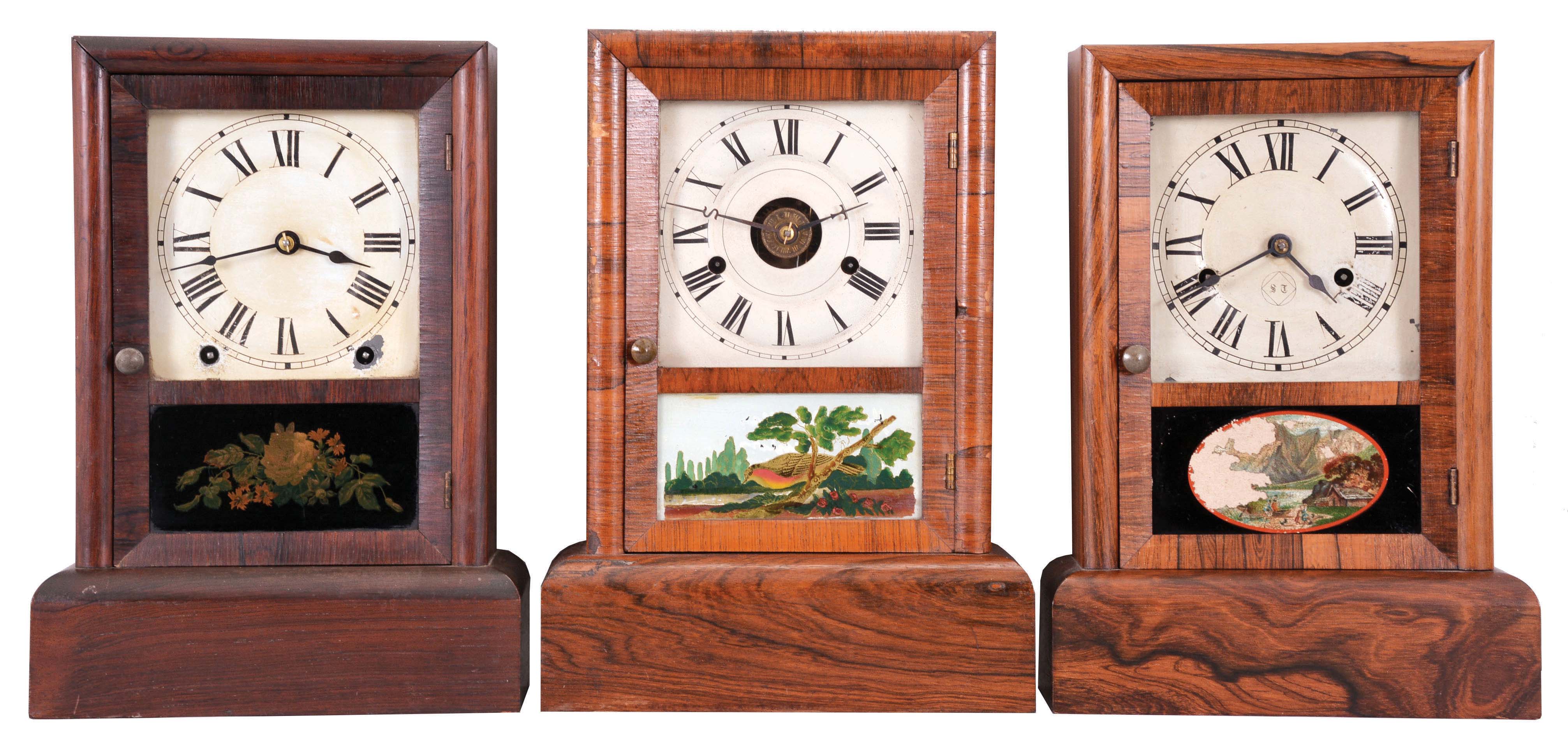 Clocks- 3 (Three): (1) Waterbury Clock Co., Waterbury, Conn., 8 day, time and strike, spring brass movement cottage clock. (2) Seth Thomas, Thomaston, Conn., 30 hour, time, strike and alarm spring brass movement cottage clock. (3) Seth Thomas, Thomaston, Conn., 30 hour, time and strike, spring brass movement cottage clock. — Antique Clocks Price Guide