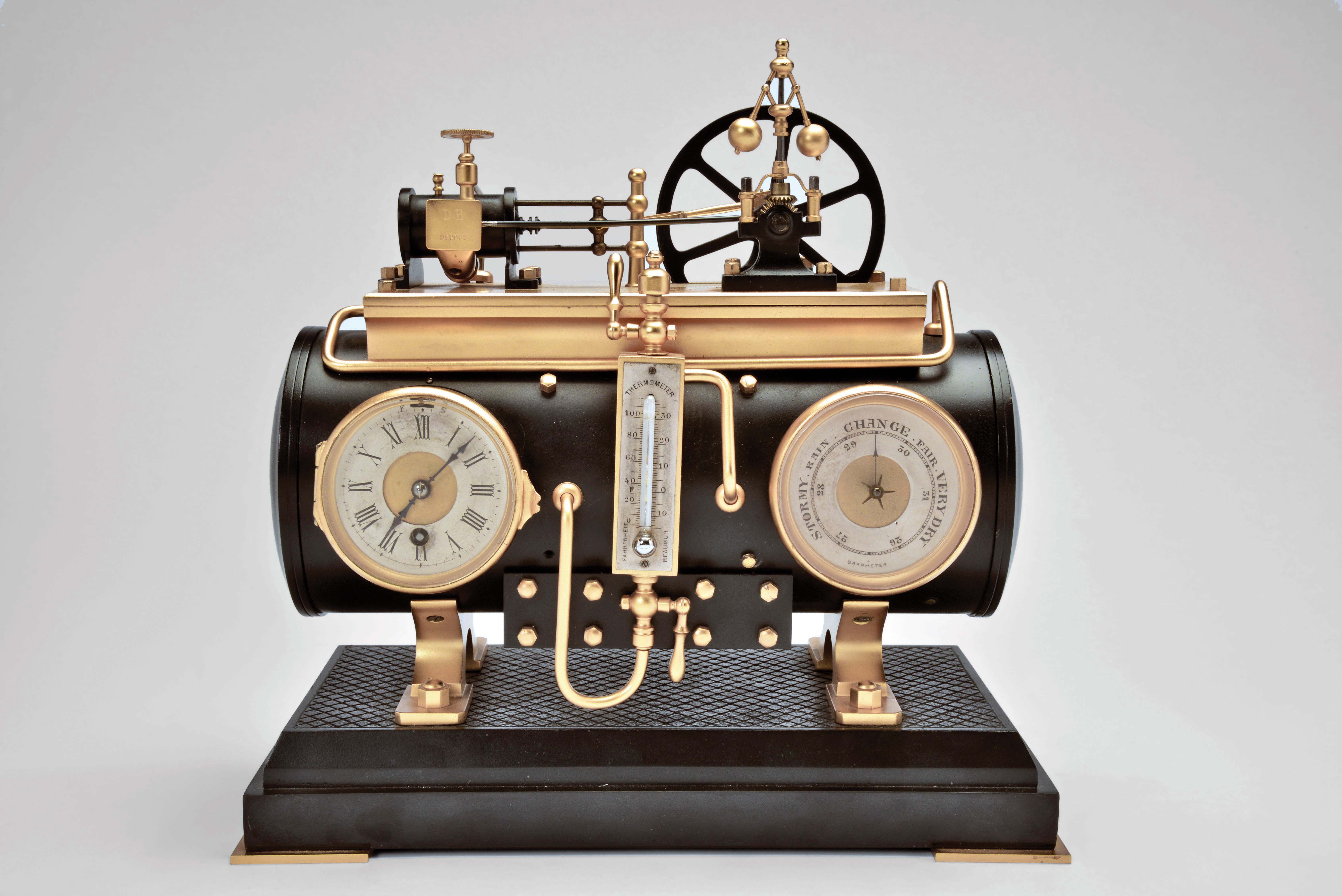 France, a rare, gilt and patinated, automated steam engine compendium, the horizontal boiler mounted to a cast floor with crosshatched surface, and resting on a black slate base, boiler fitted with an 8 day, timepiece and aneroid barometer, both with silvered dials and flanking the central thermometer with silvered scale, and surmounted by the engine flywheel, governor, cylinder and valve, the flywheel, piston, and governor powered by a movement concealed in the cylinder, the motion started and stopped through the screw in the cylinder valve, the valve front with plaque marked "D. H. Depose" — Antique Clocks Price Guide