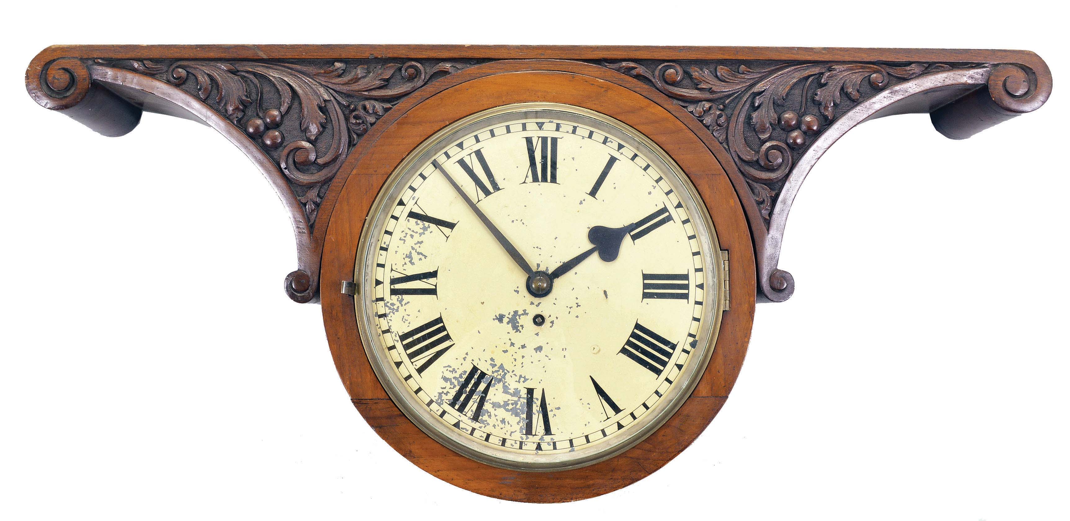 England, double-sided gallery clock, 8 day, time only, spring-driven fusee movement in a carved walnut case with 11 inch painted metal dials on opposite sides, both with cream background and black Roman numerals, blued steel Paris style spade hands. — Antique Clocks Price Guide