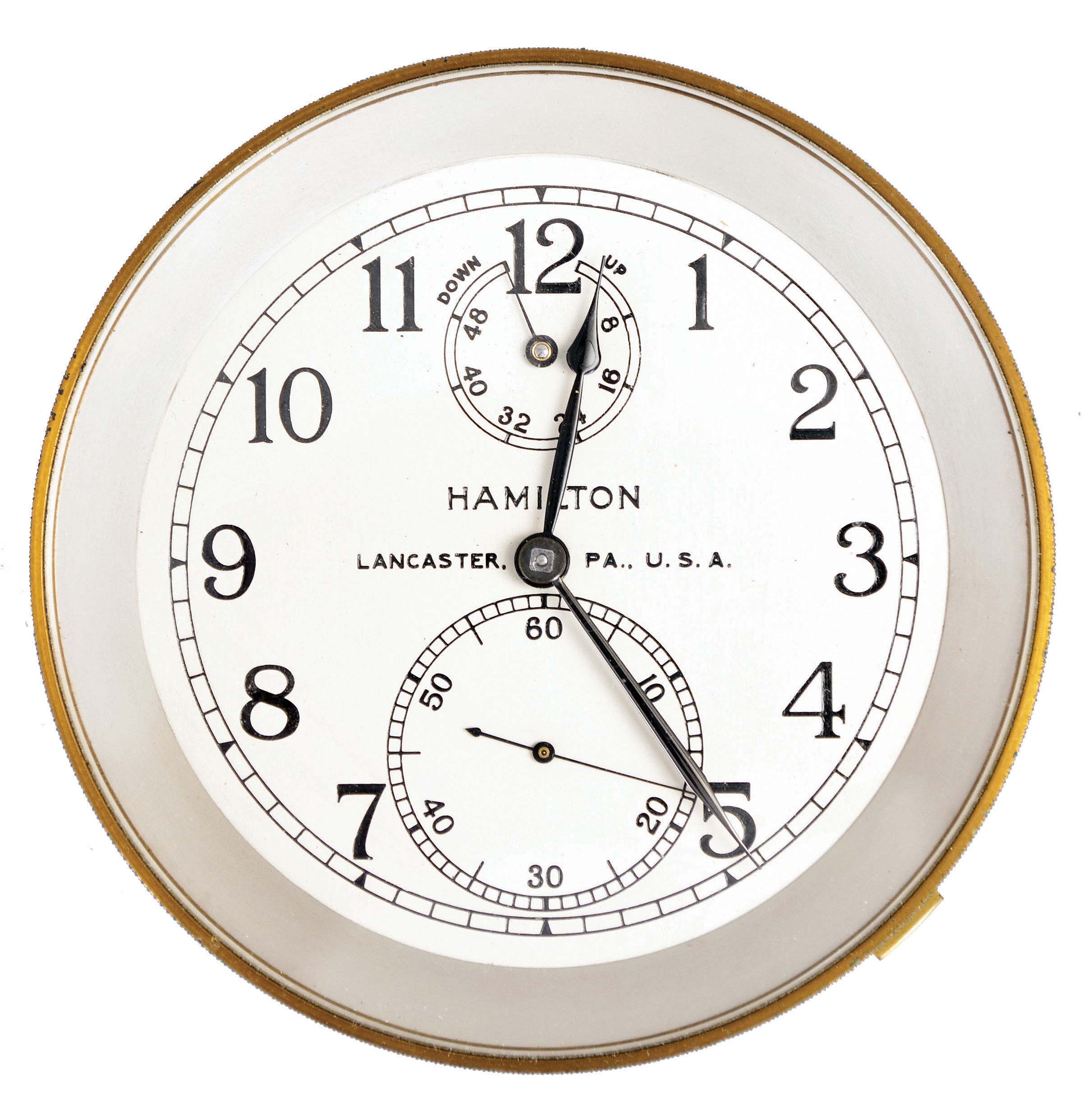 Hamilton Watch Co., Lancaster, Penn., model 21 marine chronometer and bowl only, 14 jewel, key wind and set, straight line damascened nickel plate movement with spring detent escapement and chronometer balance with helical balance spring, Arabic numeral, silvered metal dial with wind indicator, black painted steel spade and poker hands, serial #2E12680, contained in a cylindrical aluminum shipping container — Antique Clocks Price Guide