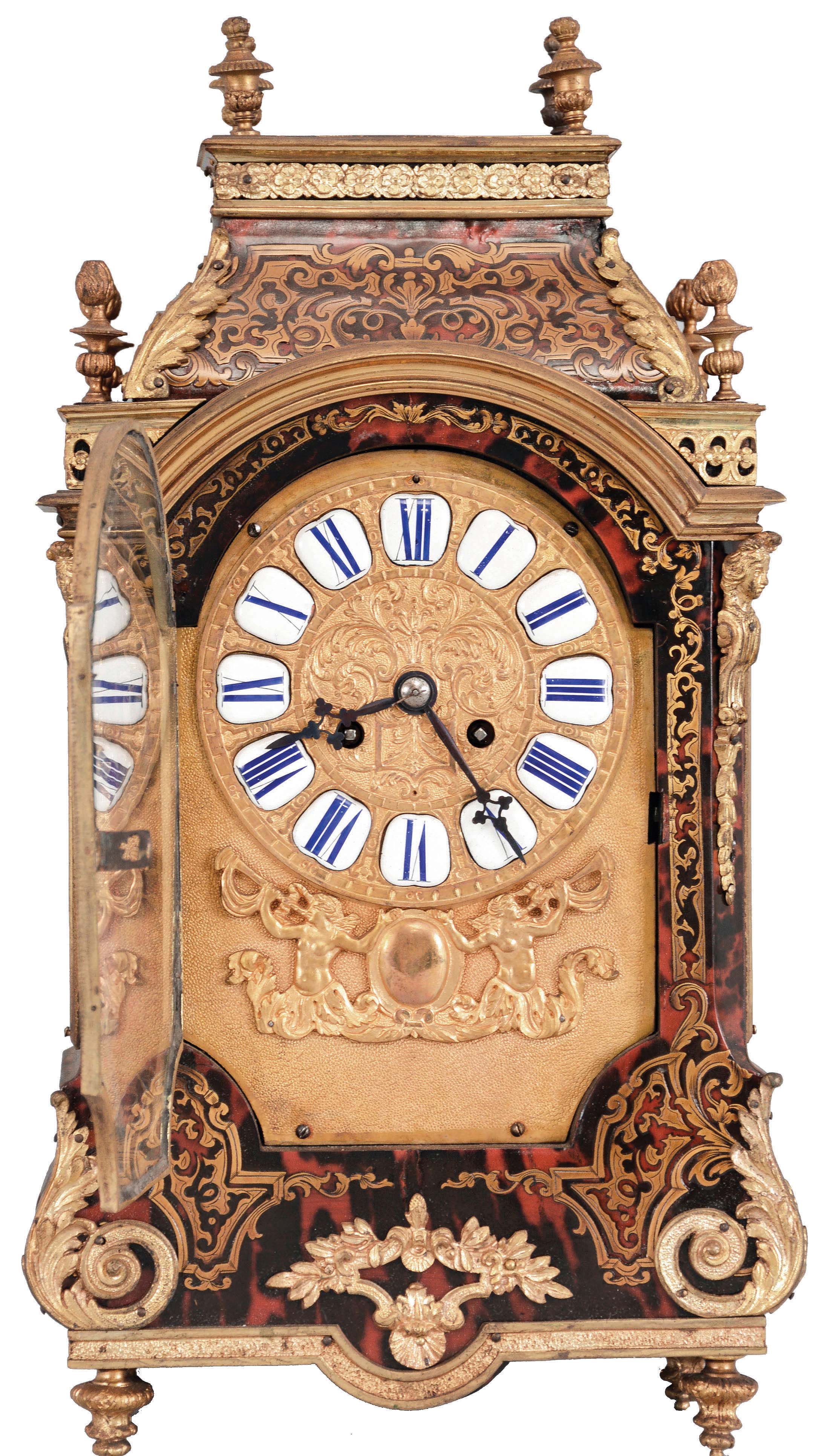 France, a late 19th century Boulle work, pendule religieuse style clock with matching bracket, the brass inlaid case on gilt feet, the base with applied foliate ornament, half caryatid corners, and gilt cornice molding, the incurved top also with acanthus mounts, and eight urn finials, shaped door, before a gilt dial plate, mounted with roman numeral, white enamel cartouches, above addorsed horn blowers and central cartouche, blued steel hands, 8 day, two train pendule de Paris movement marked "MF&amp;F", the clock resting on a cyma reversa shaped, brass inlaid, bronze mounted bracket, matching the case — Antique Clocks Price Guide