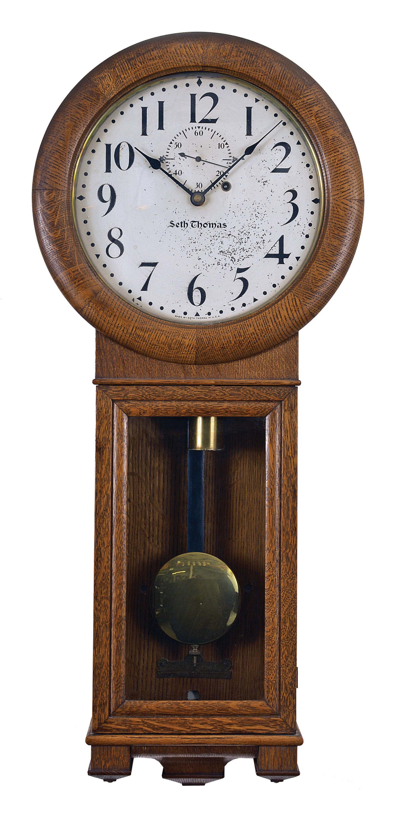 Seth Thomas Clock Co., Thomaston, Conn., "Regulator No. 2" hanging clock with a weight driven, 8 day, timepiece movement in an oak case. — Antique Clocks Price Guide