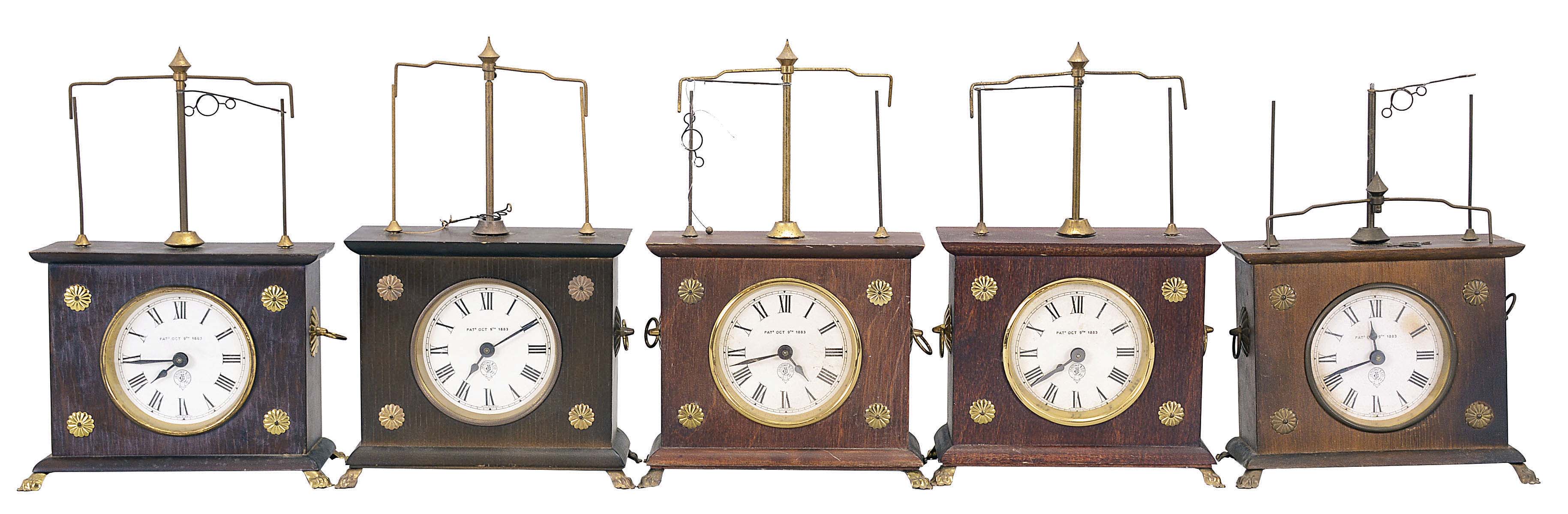 Clocks- 5 (Five) Ignatz Flying Pendulum: Horolovar Clock Co., Bronxville, New York, reproduction "Ignatz Flying Pendulum" novelty clock, 8 days, time only, spring-driven movement with flying pendulum in wood cases with paper dials. These are German-made reproductions of the 19th century model made by the New Haven Clock Co. under the Jerome label. — Antique Clocks Price Guide
