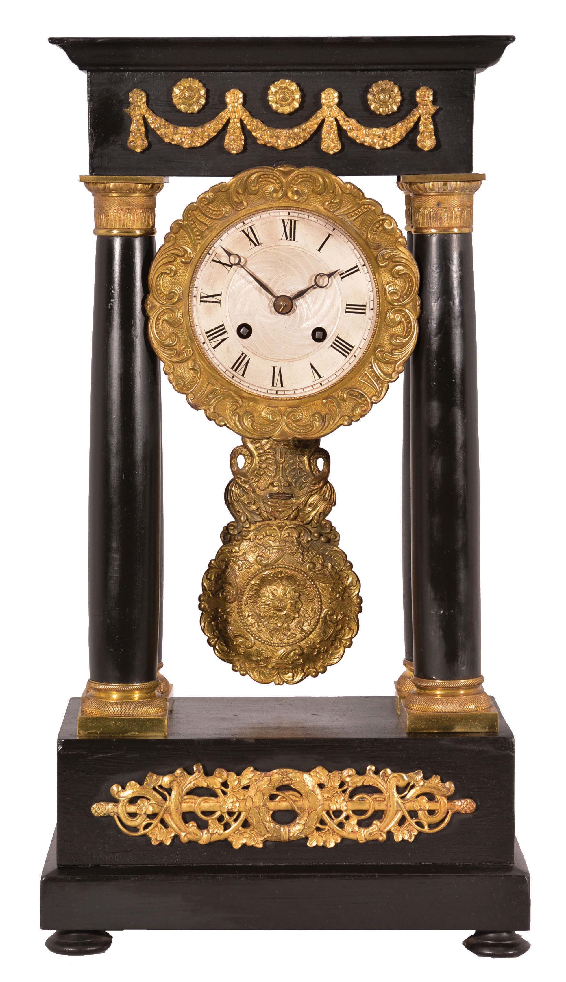 Vincenti &amp; Cie, Paris, France, French empire four-column portico clock, 8 day, time and bell strike, spring-driven pendule de Paris movement in an ebonized wood case with elaborate gilt bronze ornaments, bezel, and pendulum, 3.5 inch silvered guilloche dial with Roman numerals, Breguet style blued steel hands. — Antique Clocks Price Guide