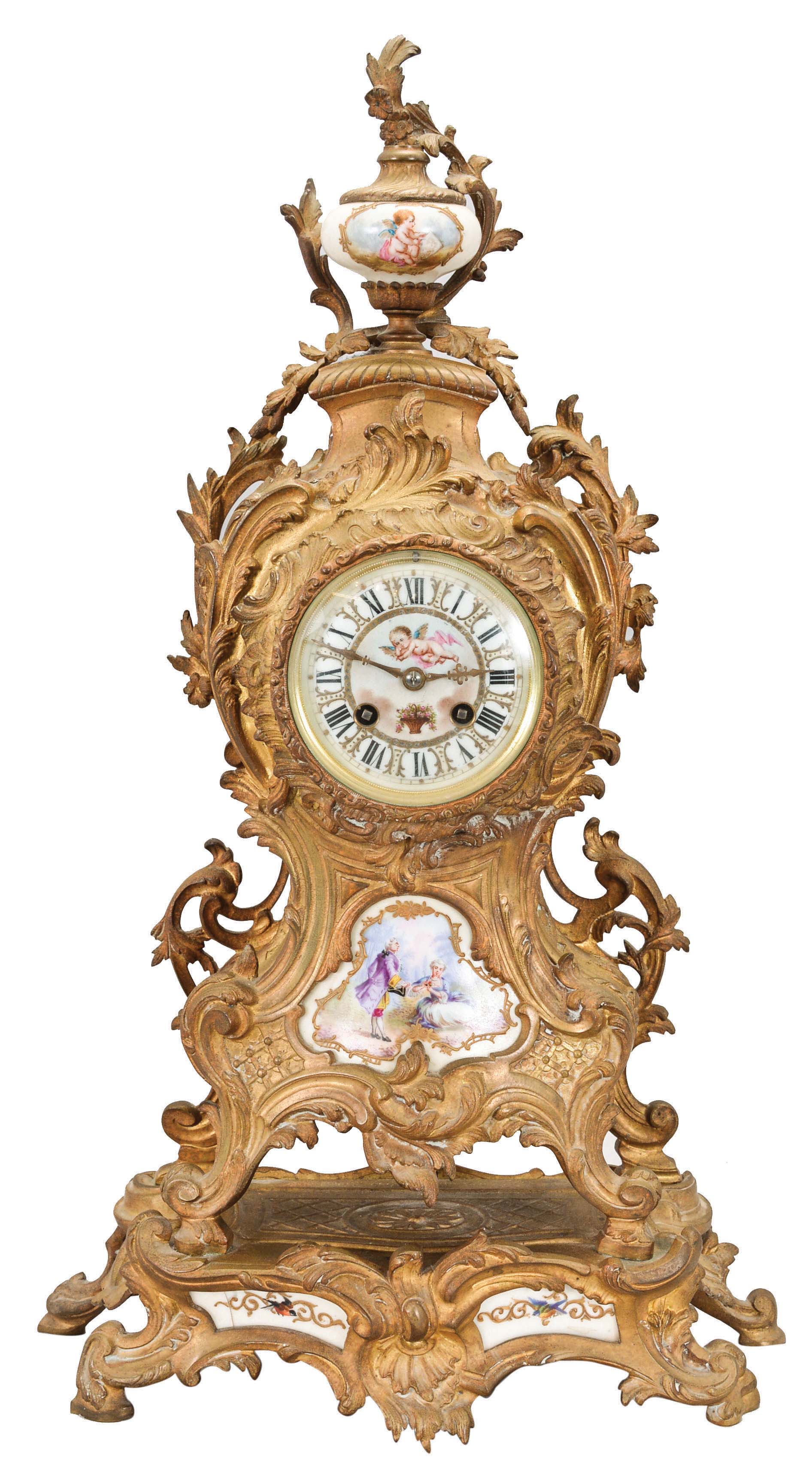 France, mantel clock, 8 day, time and strike, spring-driven pendule de Paris movement mounted in a ornate cast brass rococo style case with polychrome painted porcelain panels, the lowest depicting birds in flight, the central panel showing a courting couple, the dial and topmost urn with images of putti. — Antique Clocks Price Guide