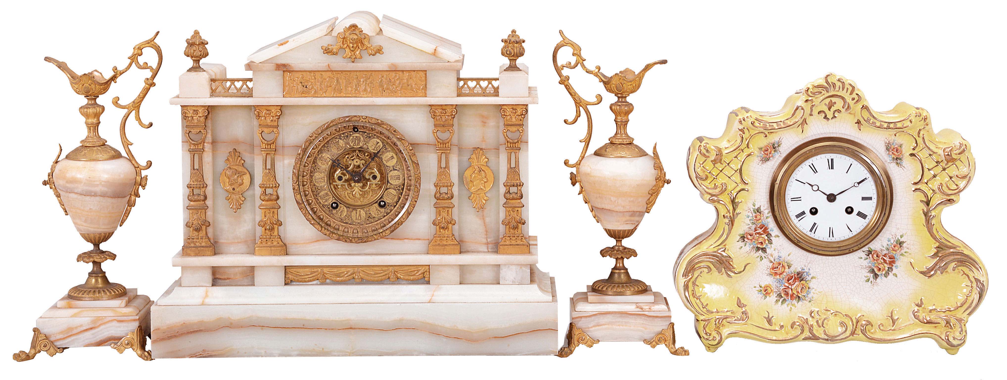 Clocks- 2 (Two) Ceramic and Onyx: (1) Ansonia Clock Co., New York, "Raleigh" 3 piece garniture set, 8 day, time and strike, spring-driven movement with visible Brocot escapement in a white onyx architectural case fitted with cast gilt ornaments with neoclassical motifs. Two matching ewer-form sidepieces of white onyx, c1895. (2) Japy Freres, Paris, for Duverdrey et Bloquel, mantel clock, 8 day, time and strike, spring-driven pendule de Paris movement in a ceramic case with yellow background, polychrome floral images, and gilt highlights, white enamel dial with blued steel hands. — Antique Clocks Price Guide
