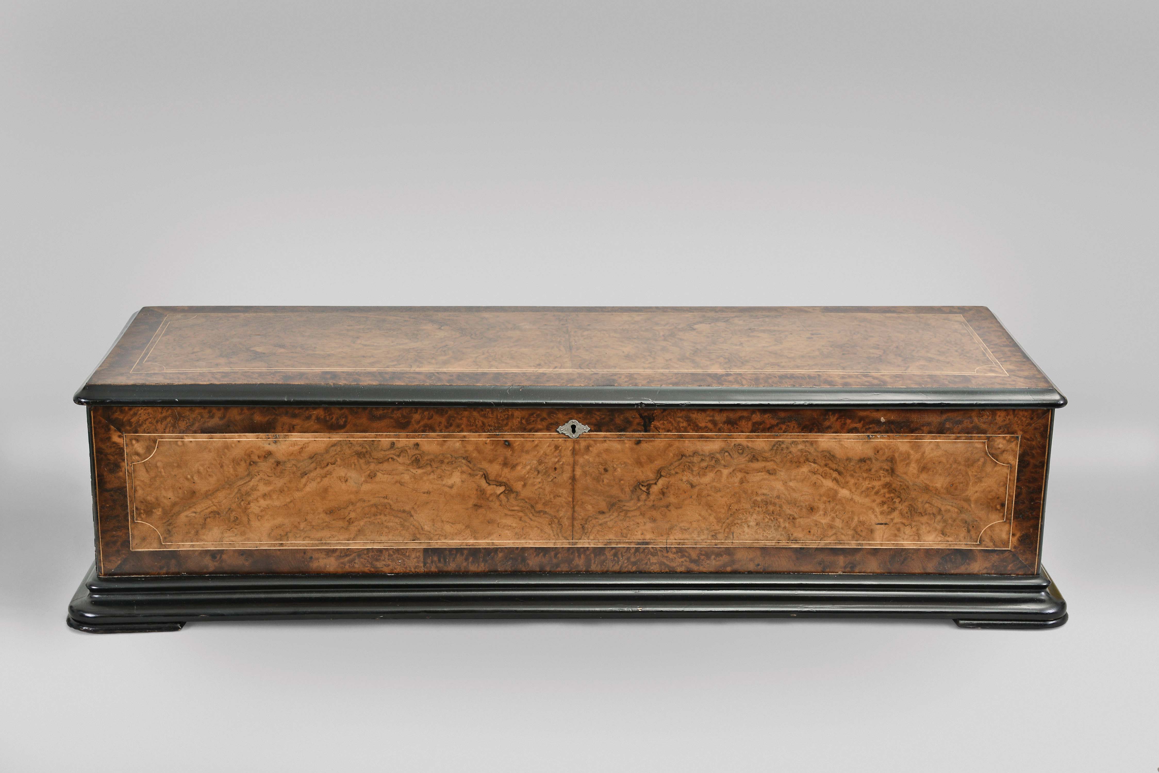 George Baker and Co., late G. Baker-Troll &amp; Co., Geneva, Switzerland, 21" cylinder music box playing 12 tunes on three combs over three octaves in a burl walnut and Carpathian elm burled veneer case with ebonized accents — Antique Clocks Price Guide