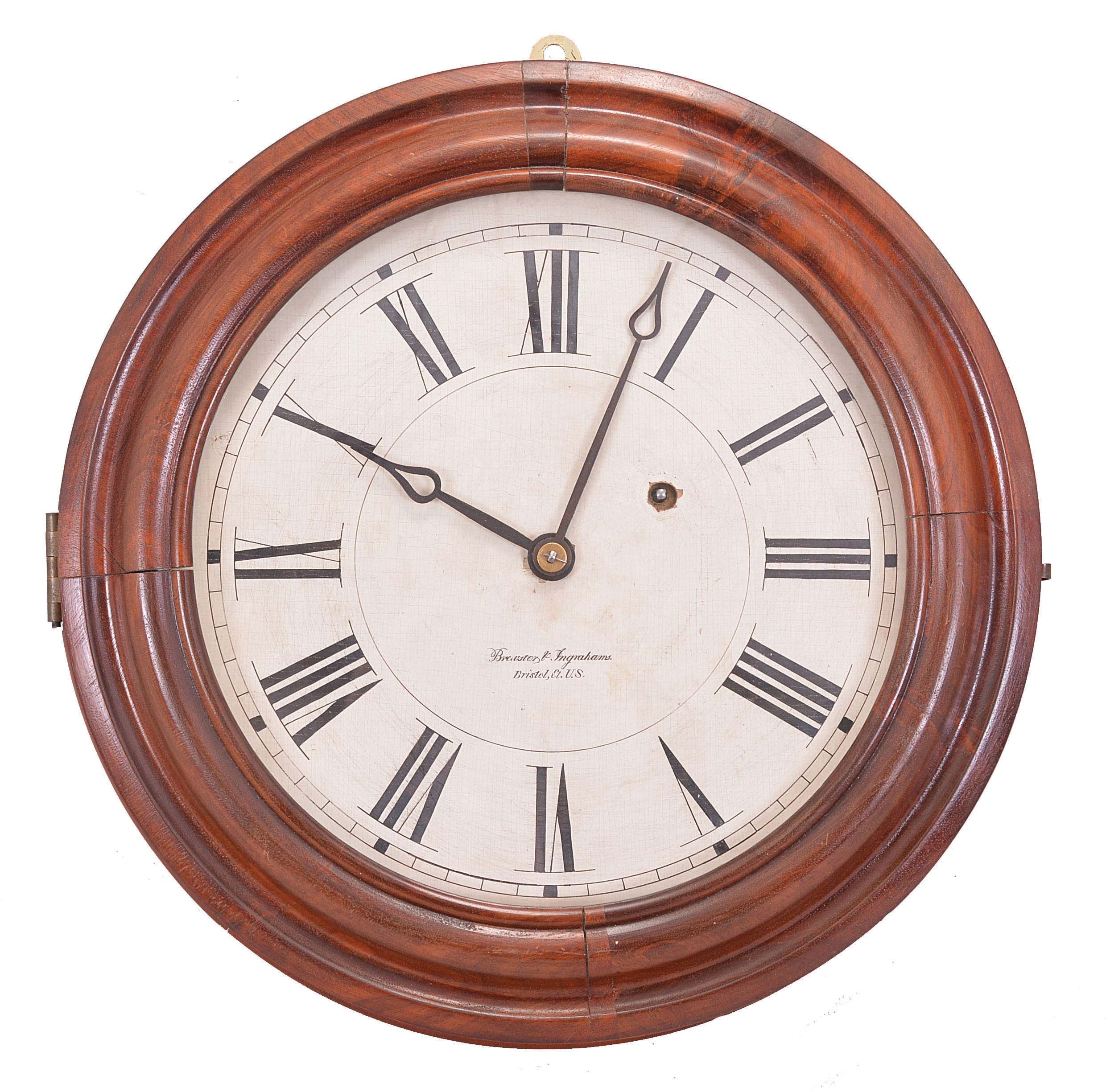Brewster &amp; Ingrahams, Bristol, Conn., Gallery hanging clock with an 8-day spring driven East-West timepiece movement with a brass spring in a crotch mahogany case. — Antique Clocks Price Guide