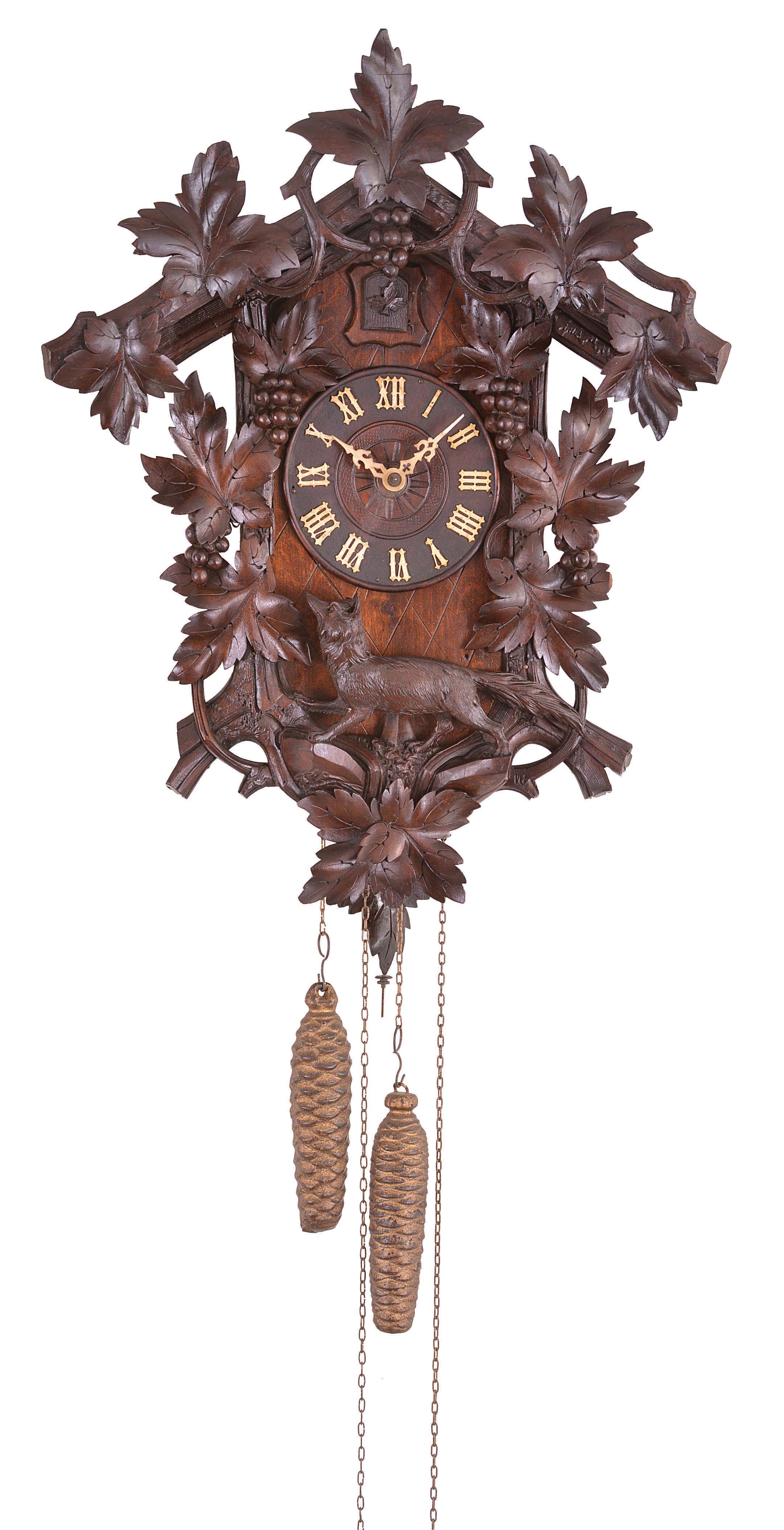 Germany, cuckoo wall clock, 30 hour, time and gong strike with animated cuckoo bird, weight driven brass movement in a wood case featuring foliage, grapes, and a fox carved in the round below the dial, painted wood cuckoo with articulated beak and wings, the dial with bone hands. — Antique Clocks Price Guide