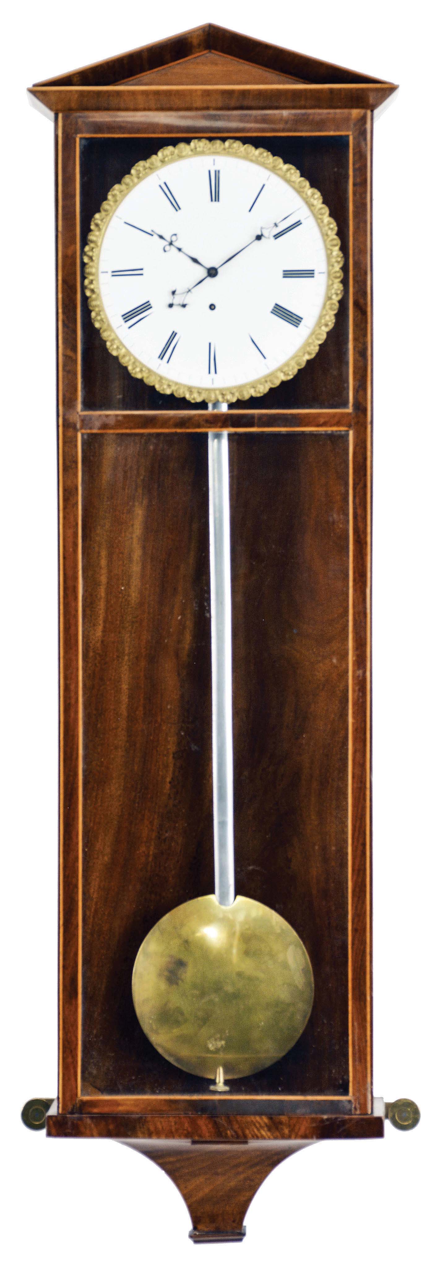 Vienna, a mahogany veneered Dachluhr timepiece, the six light case with contrasting stringing, deeply incurved bracket, and top with shallow pitched pediment with bevel moldings, piecrust bezel with roman numeral white enamel dial, the back marked "L. Mosslinger", pierced, blued steel hands, 8 day movement with dead beat escapement, pendulum with steel rod and brass bob, and brass clad weight with four spoke pulley — Antique Clocks Price Guide