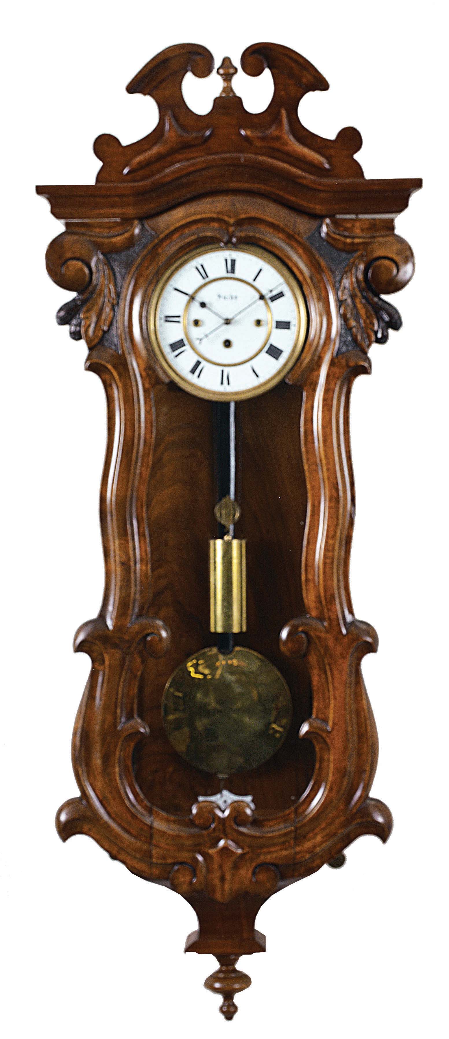 Clocks- 2 (Two) Vienna regulators: (1) C. Suchy &amp; Sohne, Vienna, Austria, 30 hour, time and grande sonnerie strike on two gongs, movement driven by two springs and one weight in a serpentine wood case with some walnut veneer, enamel dial signed "Suchy", c1865. (2) Gustav Becker, Freiberg, Germany, 8 day, time and strike, weight driven movement in a walnut and walnut veneer altdeutsch style case, c1875. — Antique Clocks Price Guide