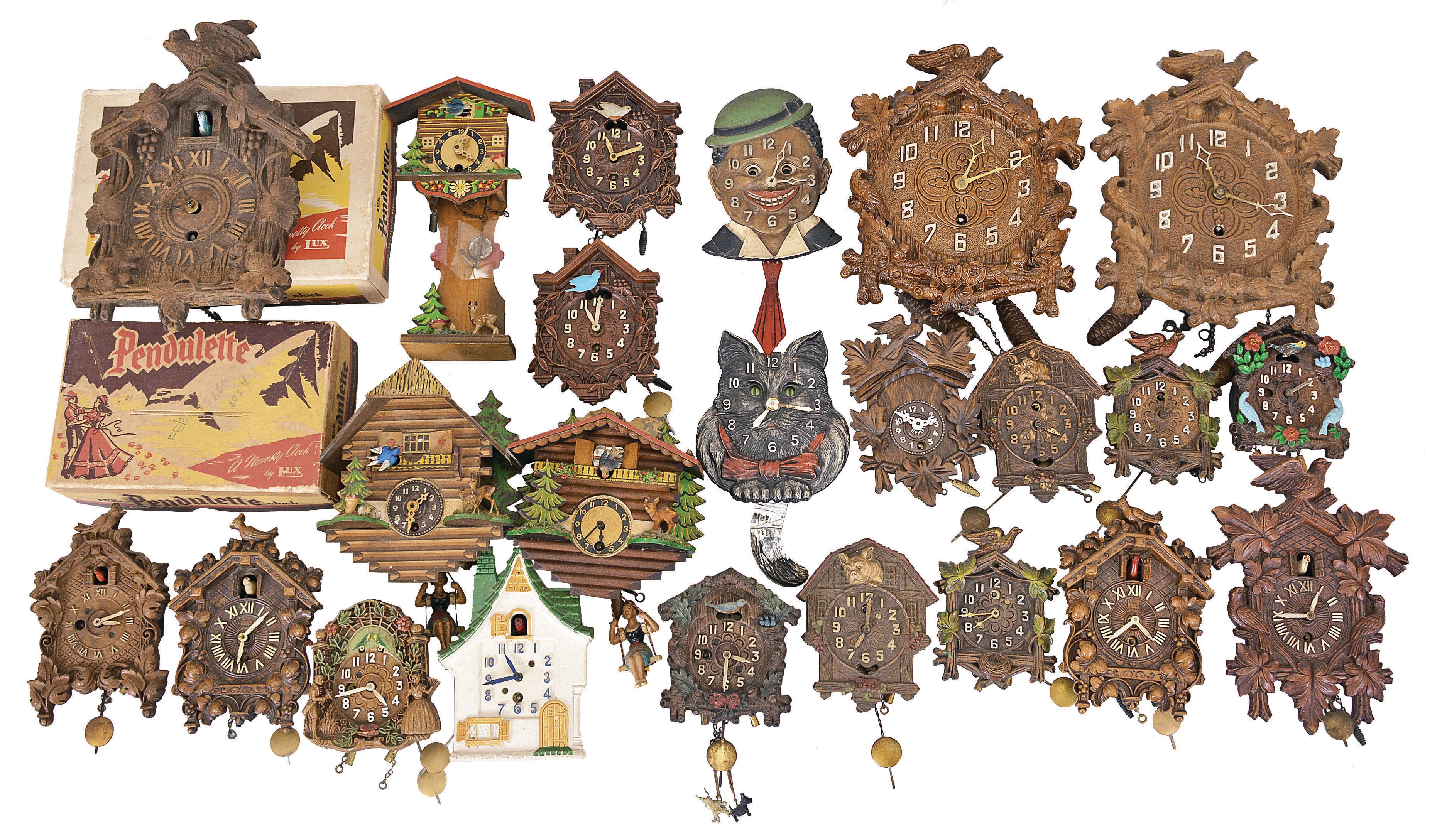 Clocks- 42 (Forty-two) Novelty and Desk: wide assortment of small clocks, some mechanical and some electric. Many Lux pendulettes including models such as the "Cat", "Dixie Boy", "Georgian Banjo", and many cuckoo themed models. — Antique Clocks Price Guide