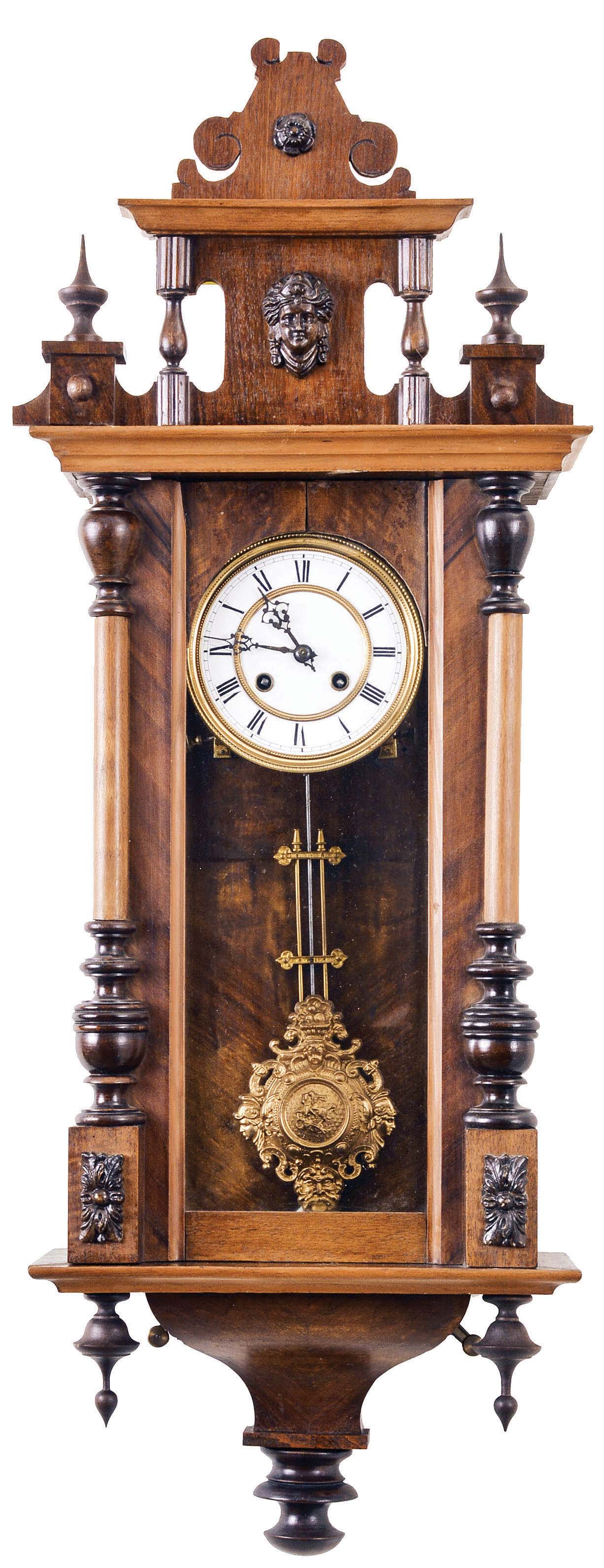 Clocks- 3 (Three) wall clocks, Germany, 8 day, time and strike: (1) Spring driven in walnut case with a fancy metal pendulum; (2) Spring driven in a walnut case; (3) Three weight, chiming Vienna regulator in a dark finished case — Antique Clocks Price Guide