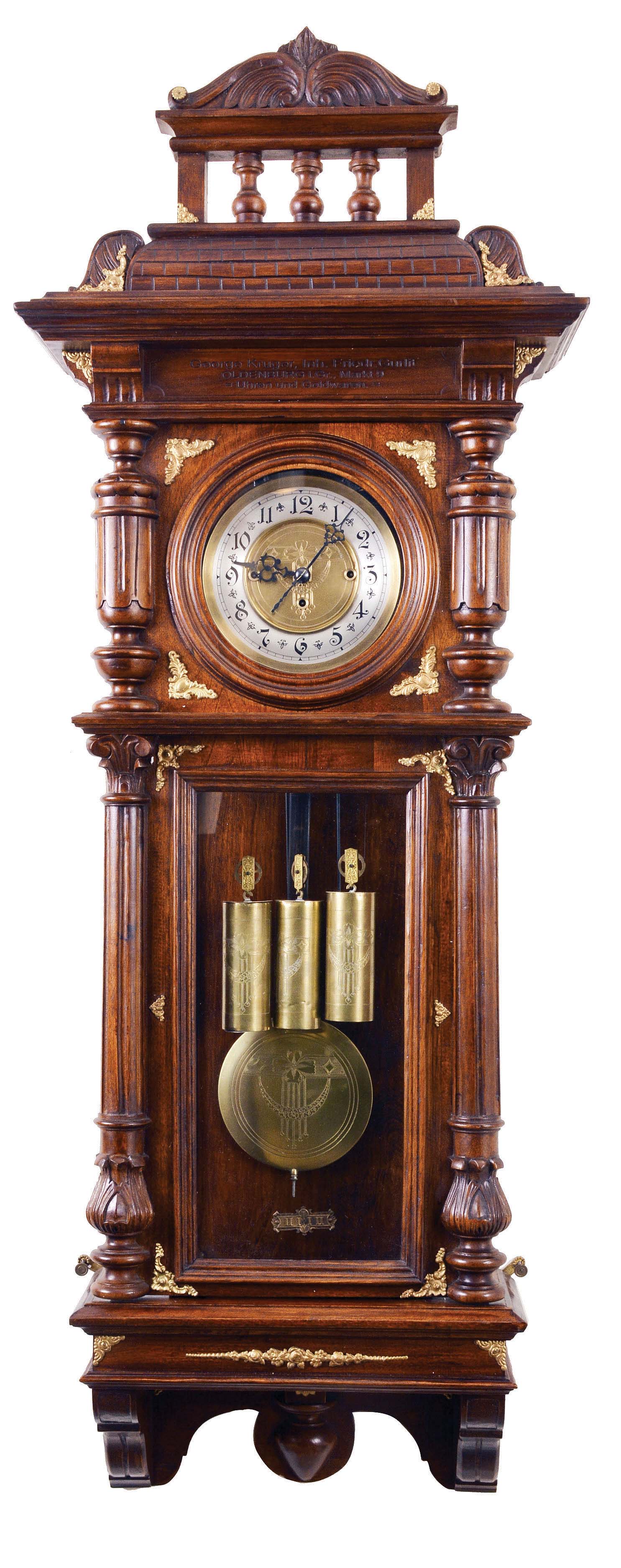 Clocks- 2 (Two) Vienna style wall clocks, Germany, 8 day, time and strike, weight driven in a walnut case: (1) Gustav Becker, grande sonnerie, three weight chiming with brass elements and engraving in frieze advertising for jeweler and clockmaker in Oldenburg, engraved dial center with matching pendulum and weights; (2) Unsigned, two weight in a burl case with ebonized trim — Antique Clocks Price Guide