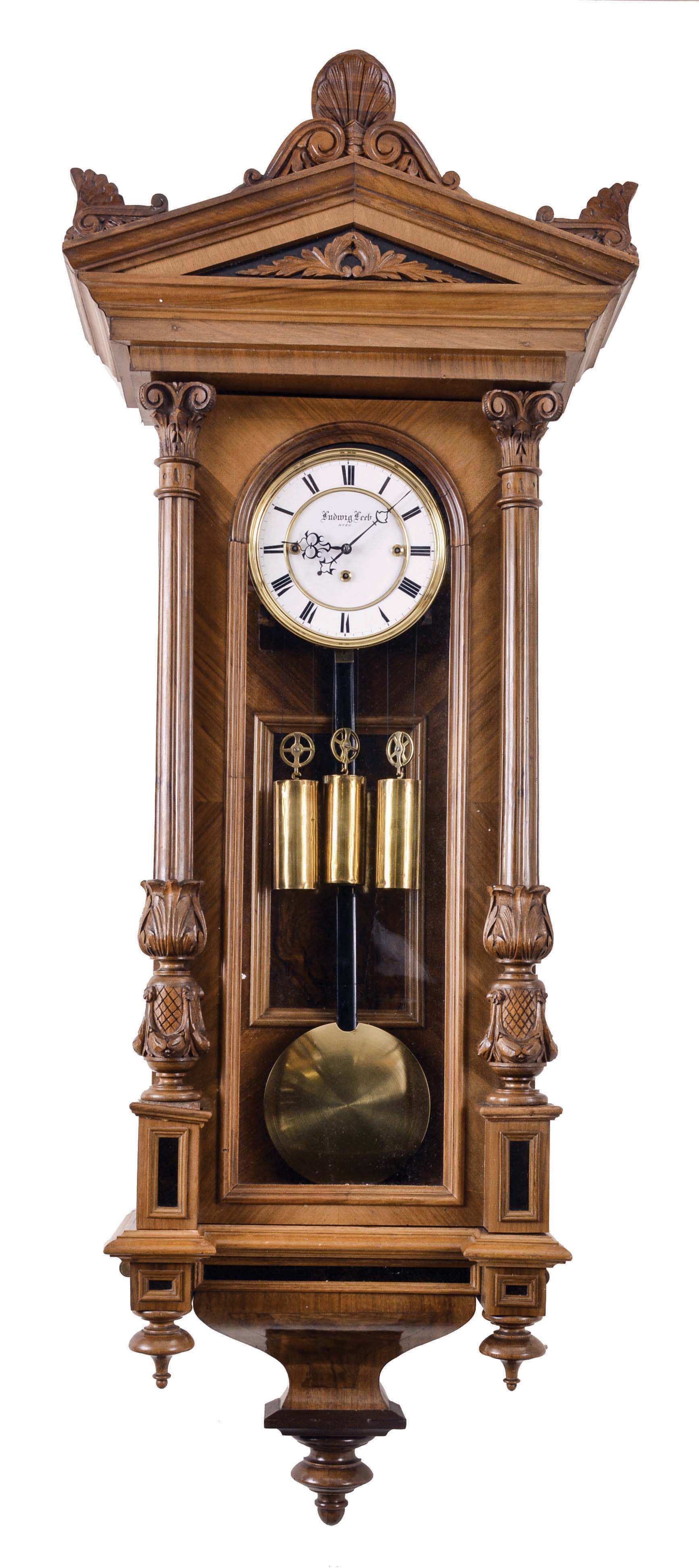 Ludwig Leeb, Horn, Germany, Vienna regulator wall clock, 8 day, time, strike and grande sonnerie with pull repeat, weight driven movement in a carved walnut Altdeutsch case with ebonized accents and white enamel dial — Antique Clocks Price Guide