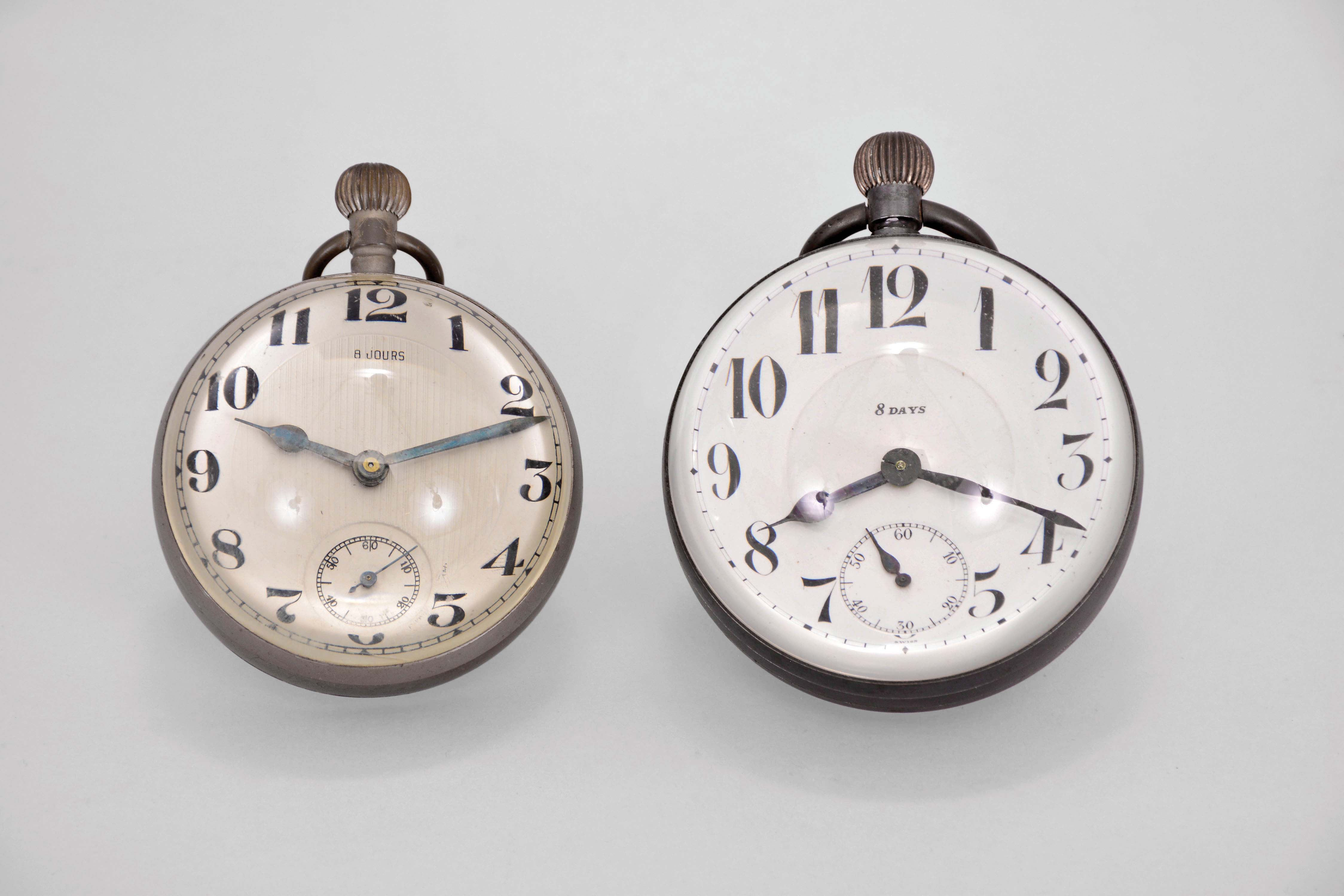Paperweight clocks- 2 (Two), one marked "Octavia Watch Co.", both with spherical, colorless glass cases and Swiss eight day lever movements, one with Arabic numeral, double sunk white enamel dial, the other with Arabic numeral metal dial, 69mm, 77mm, c1910 — Antique Clocks Price Guide