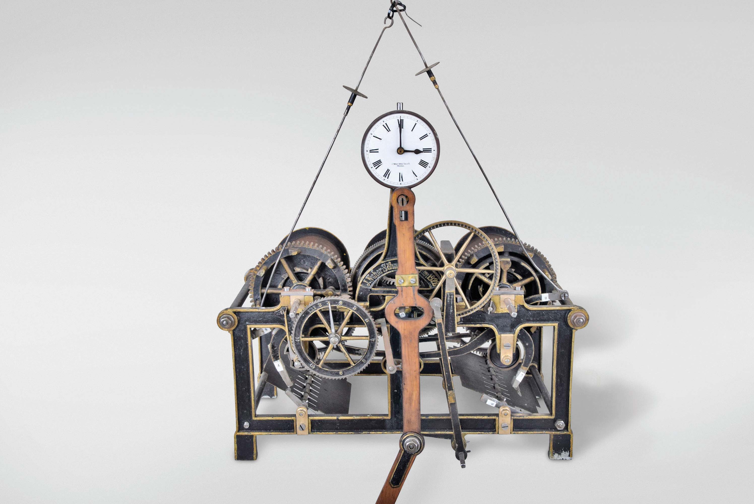 J. Neher, Schne, Munchen, Germany tower clock, time, strike and chime, weight driven movement with pinwheel escapement and wooden drums on painted cast iron frame, dated 1928 — Antique Clocks Price Guide