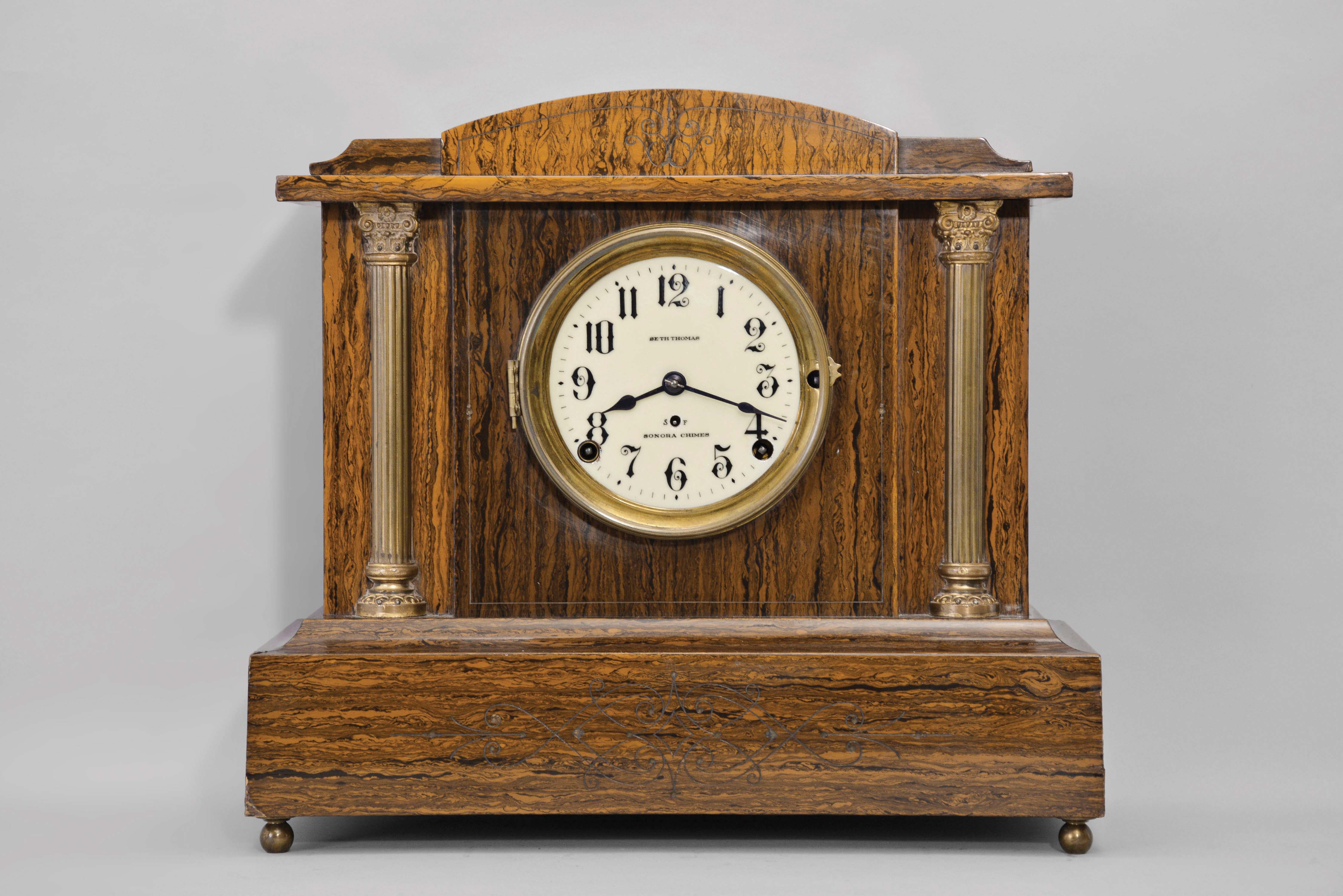 Seth Thomas Clock Co., Thomaston, Conn., "Hastings", 8 day, time and strike, spring brass 4-bell Sonora chime movement Adamantine case mantel clock. — Antique Clocks Price Guide