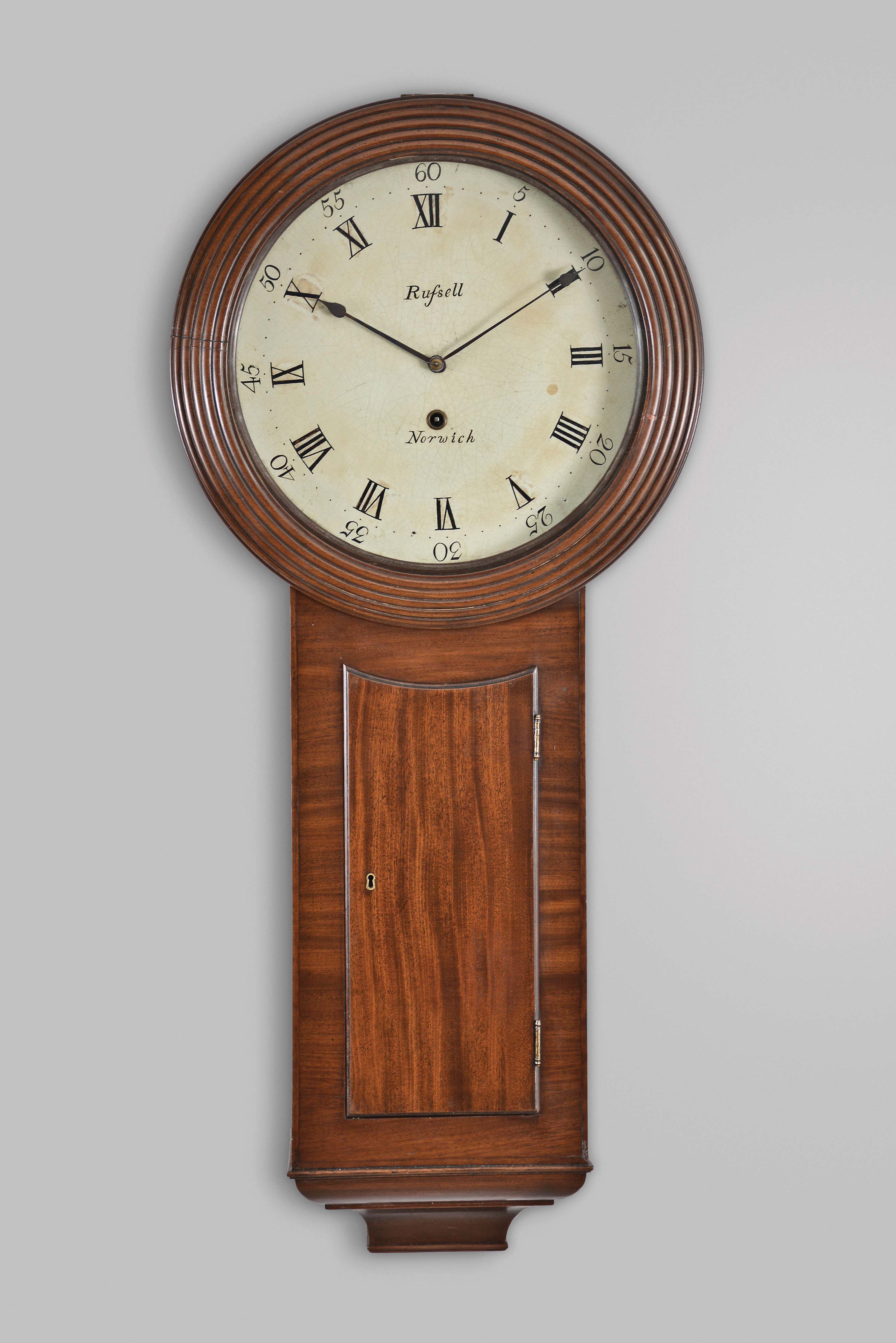 English, 8 day, weight driven brass movement tavern-style wall timepiece. Dial is signed: "Rufsell, Norwich" [actually Russell as "fs" is double "s" in early script]. — Antique Clocks Price Guide