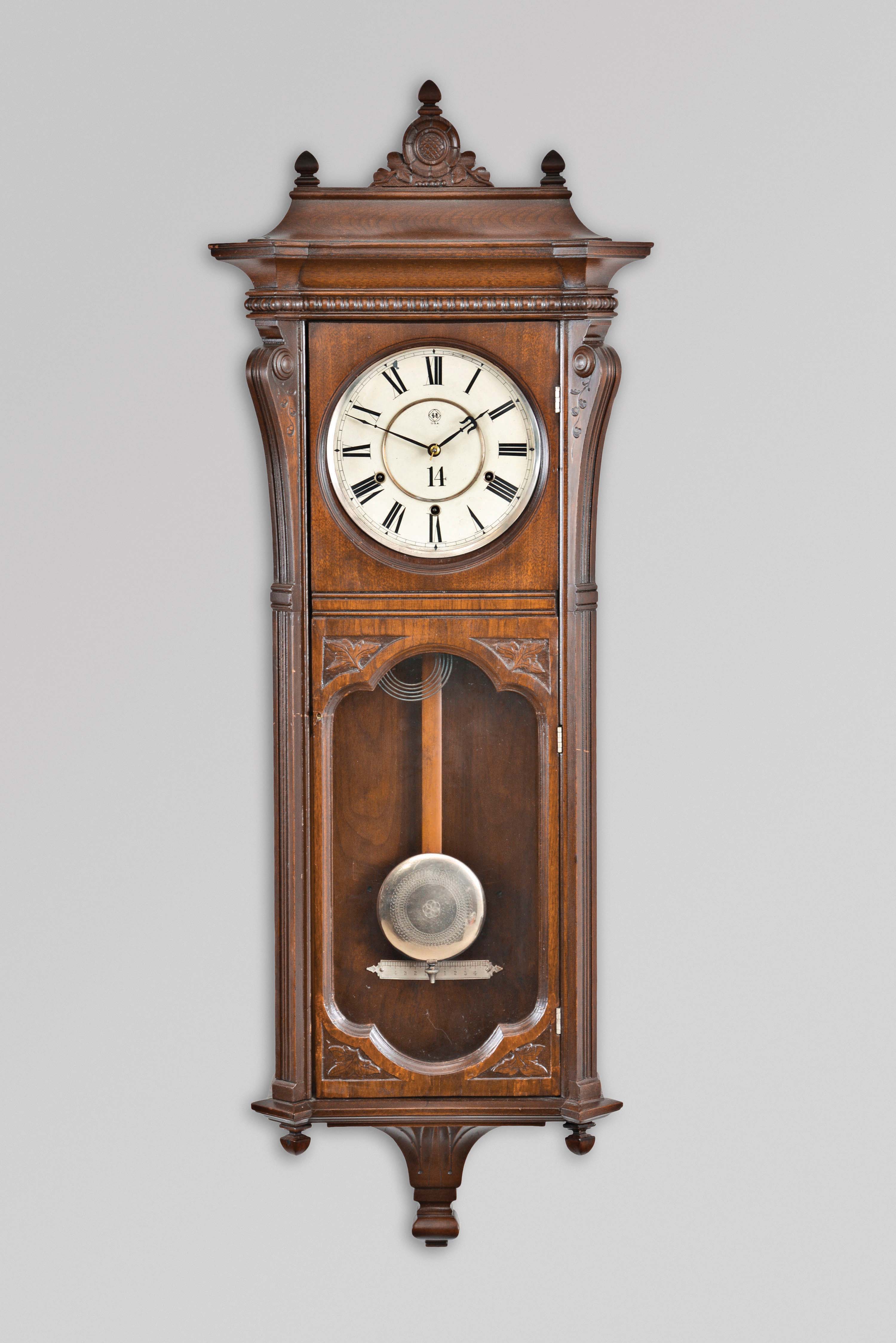 Seth Thomas Clock Co., Thomaston, Conn., "Marcy" wall hanging clock with an 8 day, 3-train, spring driven, time and strike movement with cathedral gong strike on the hour and quarter hour striking on 2 cup bells in a walnut case. — Antique Clocks Price Guide