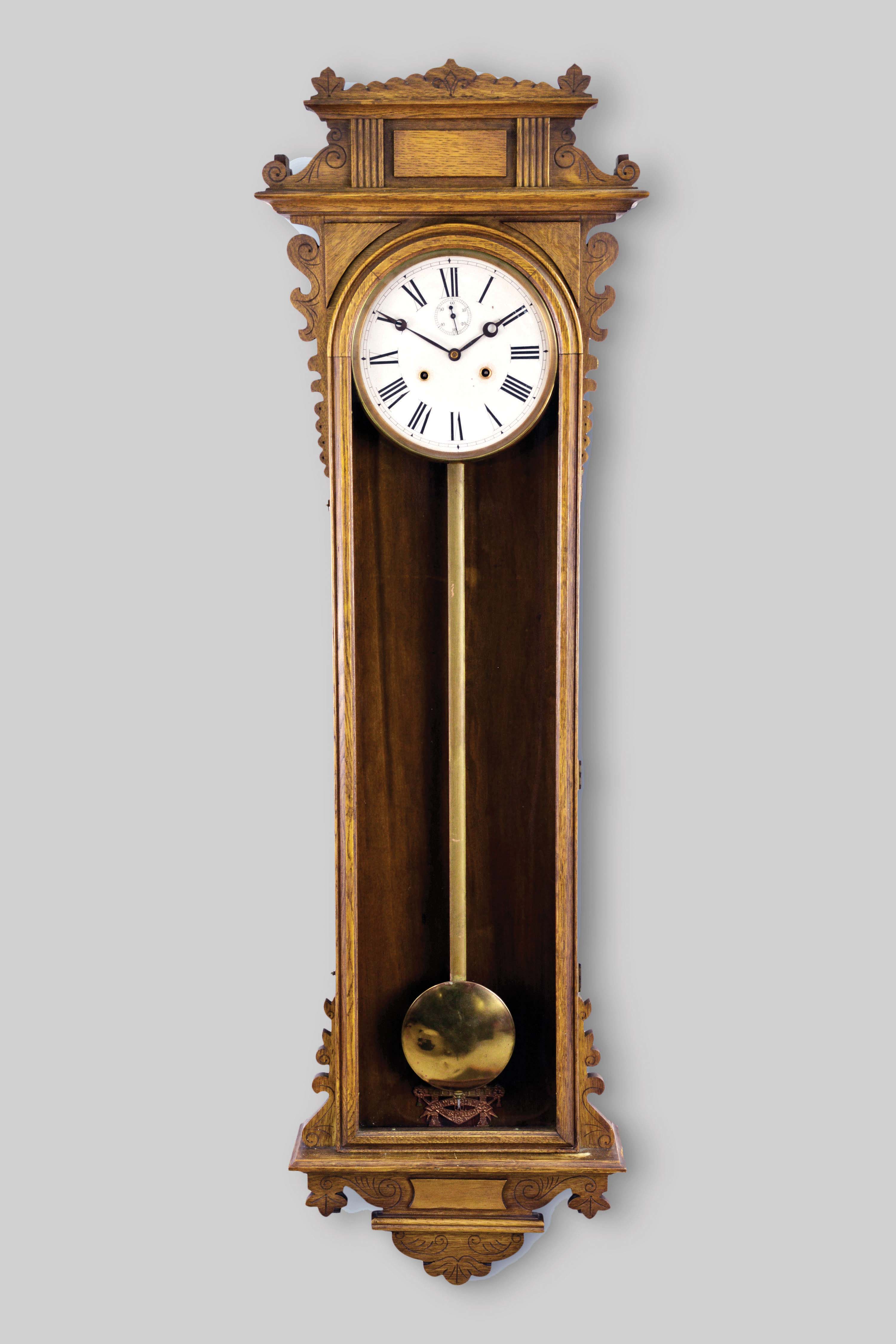 E. N. Welch Mfg. Co., Forestville, Conn., "Regulator No. 11" wall hanging clock with a spring driven double wind 30 day timepiece movement in an oak case. — Antique Clocks Price Guide